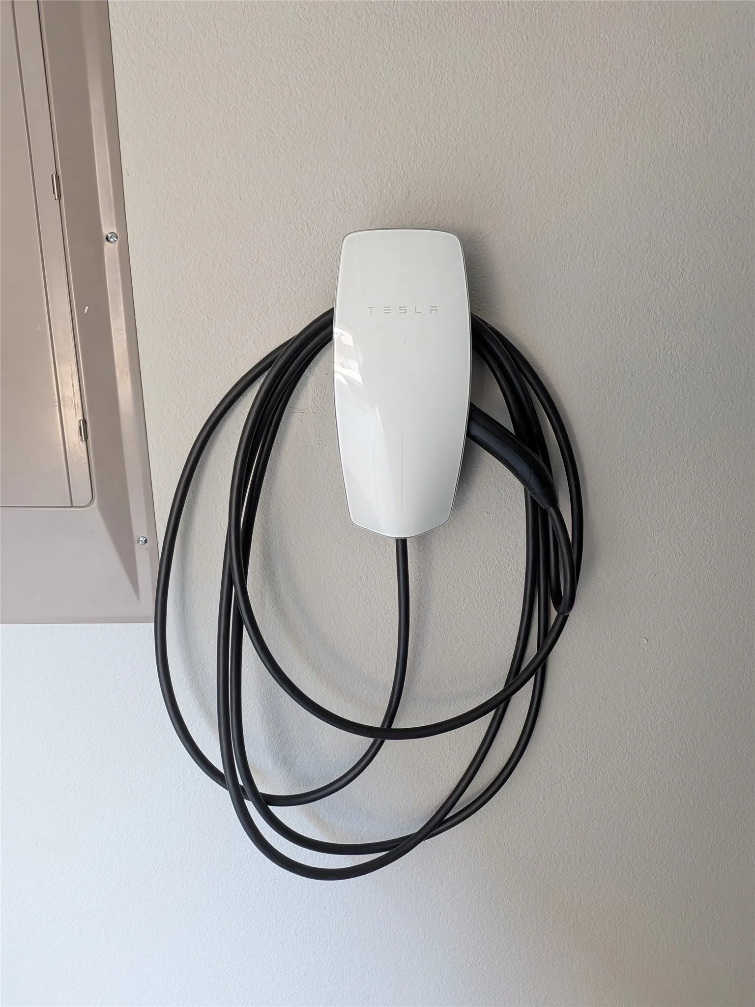 Electric vehicle charging station inside garage