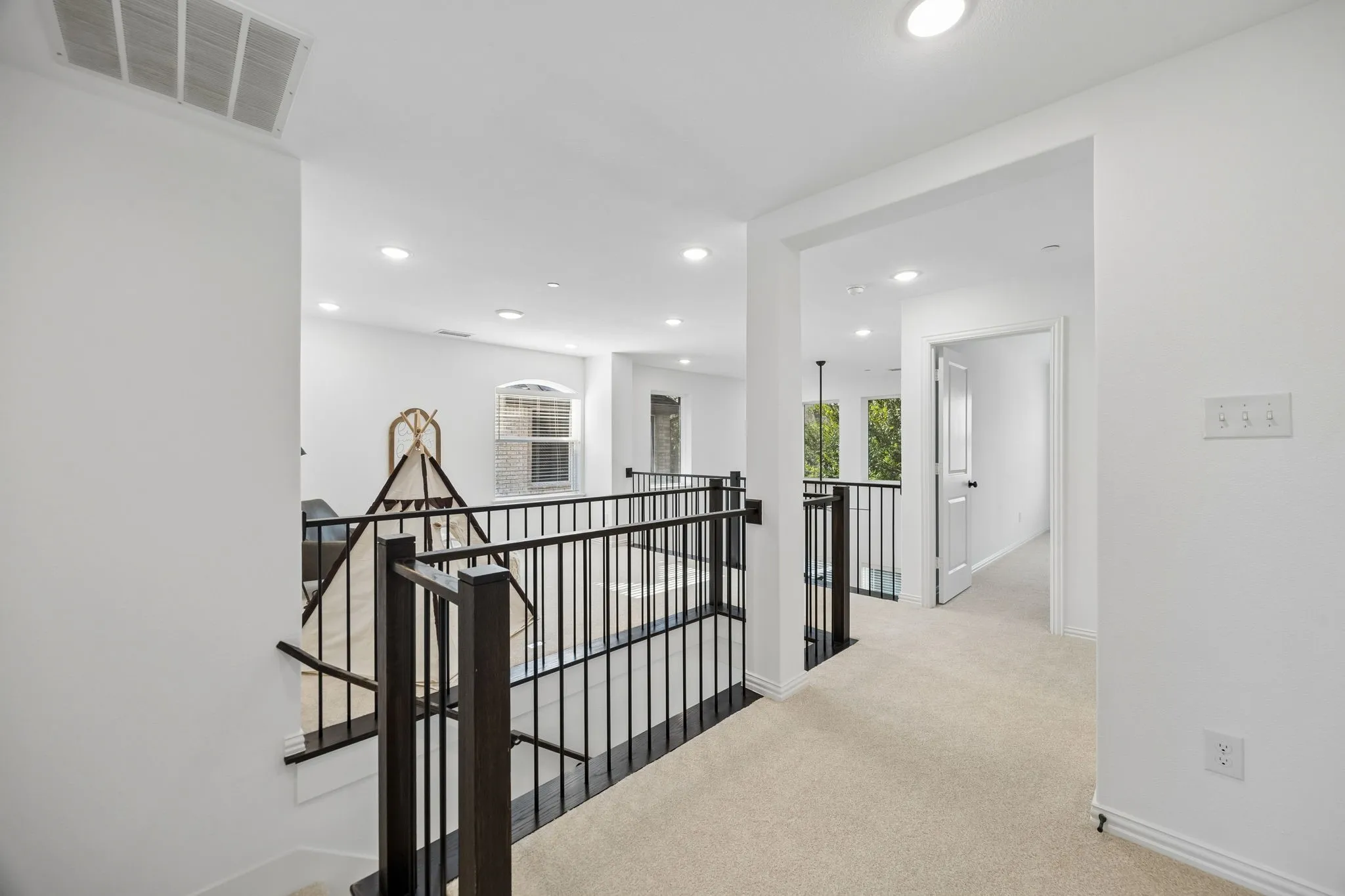 secondary bedroom separate from primary as well as upstairs laundry