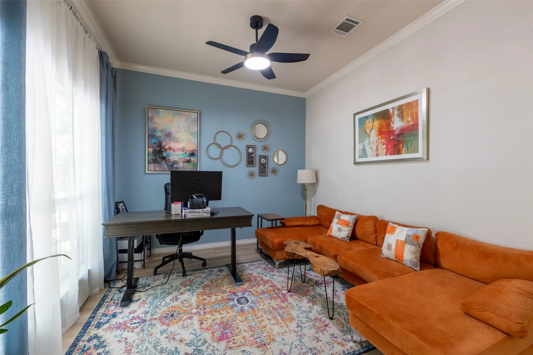 Recessed lighting, crown molding, and a modern ceiling fan with integrated lighting