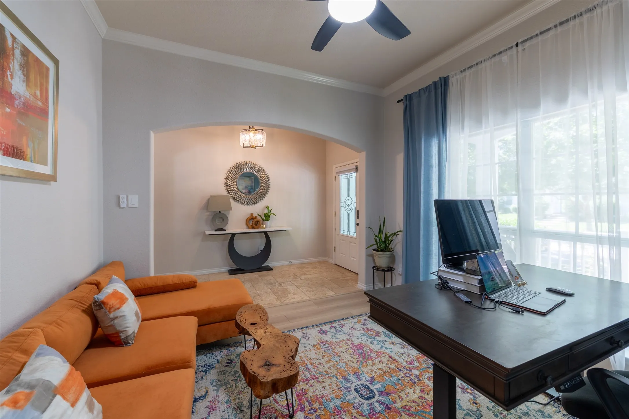 Recessed lighting, wood-finish flooring, ceiling fan, arched doorway, and decorative front entry door