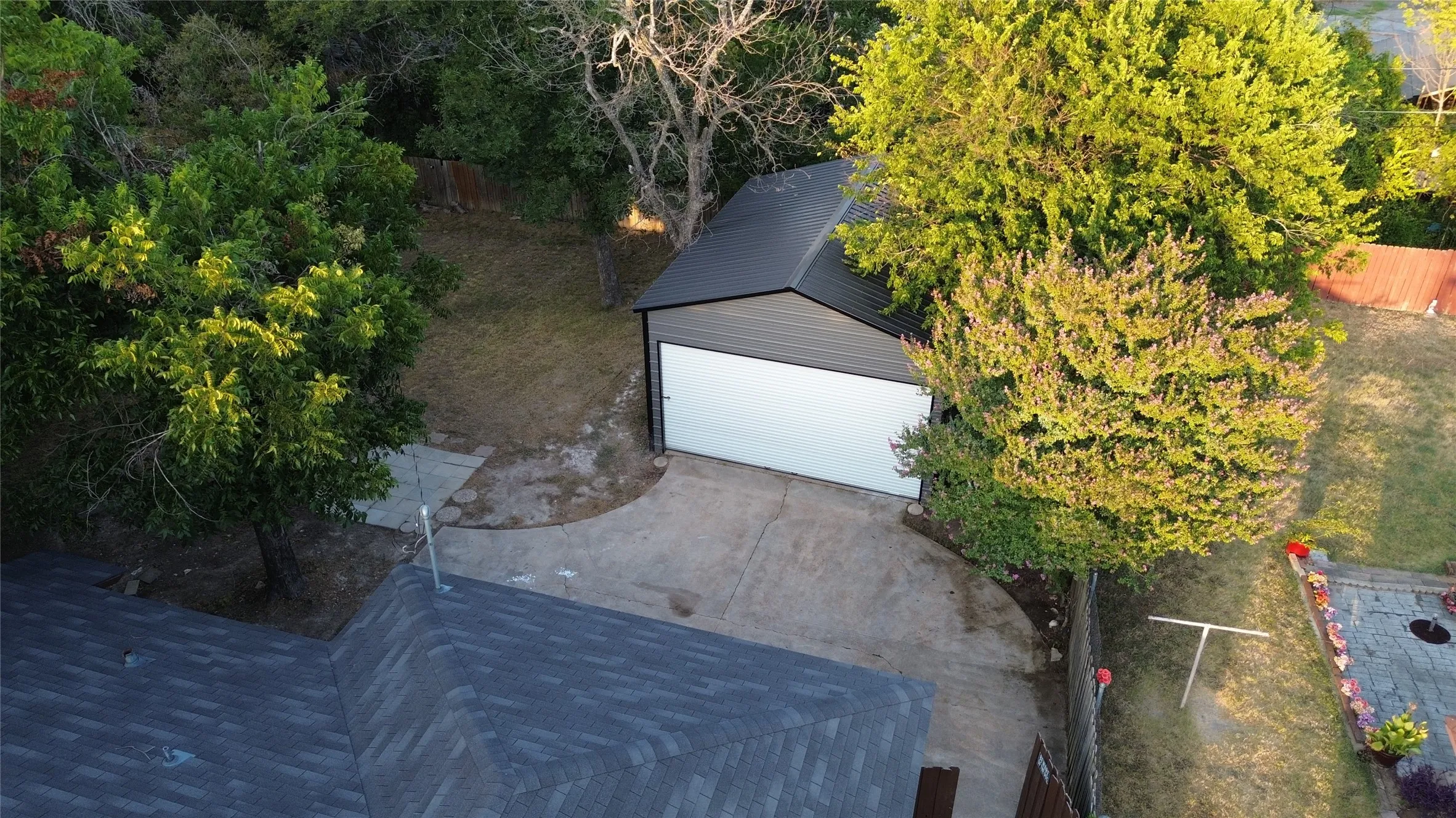 Detached structure with a metal roof and large garage door