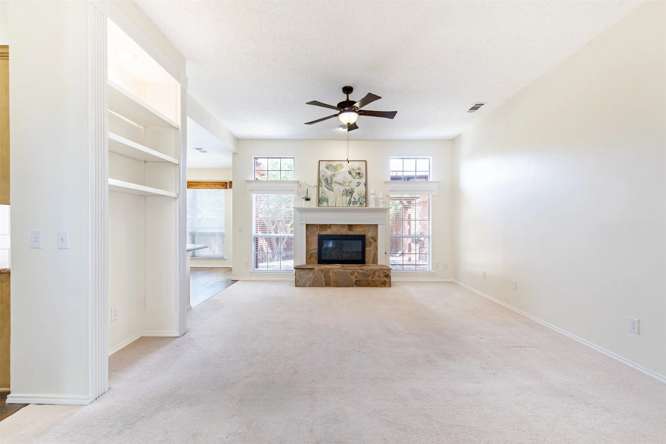 Impressive living room with built-in's and natural light.