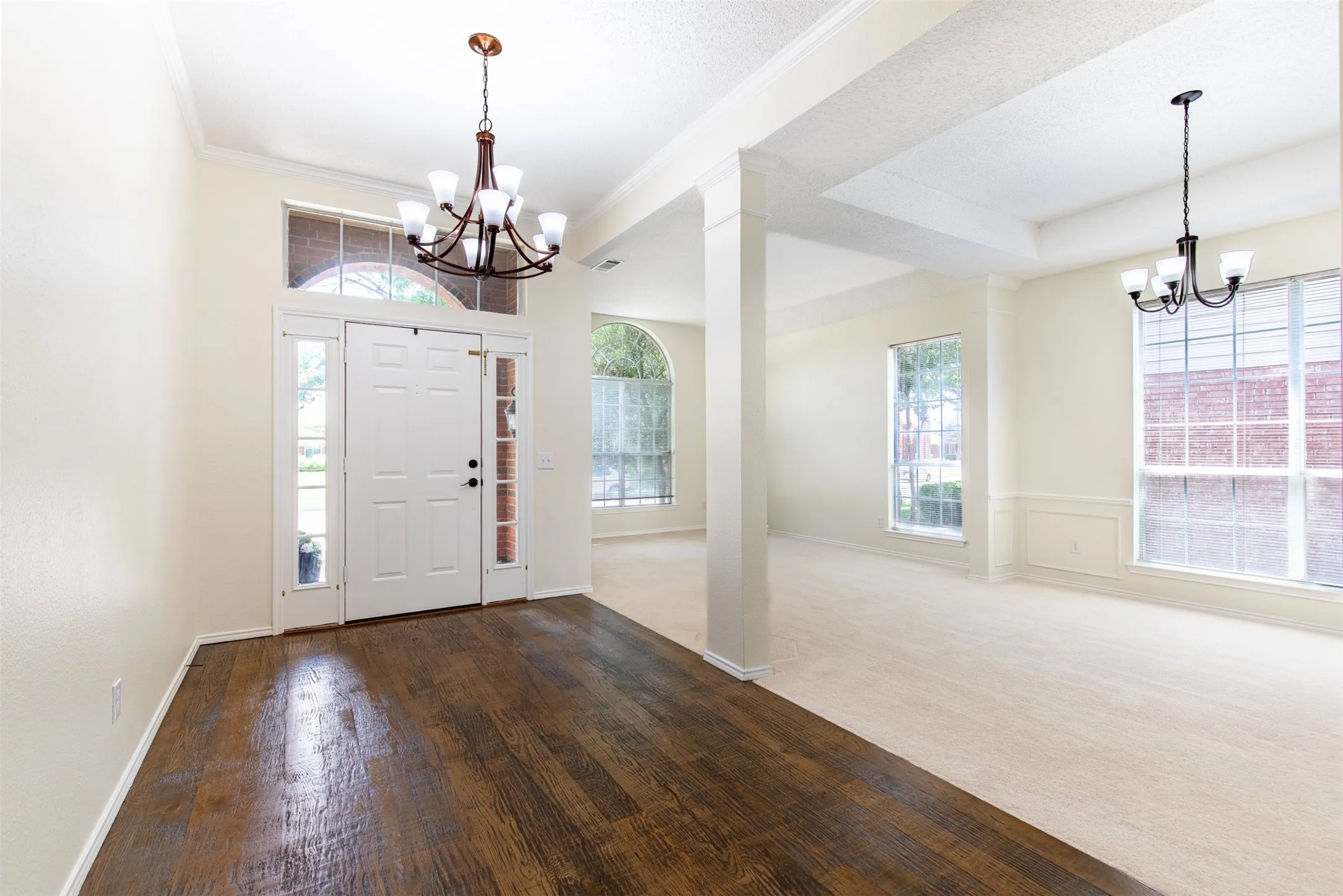Expansive foyer opens to formal living and dining rooms.