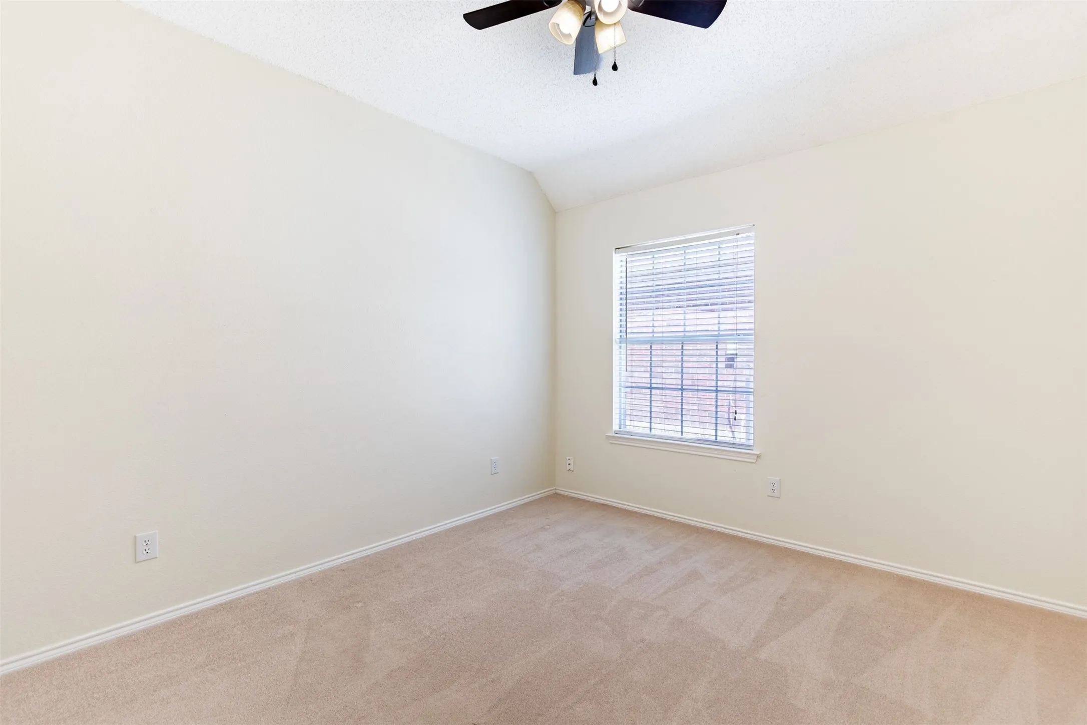 Secondary bedroom with double-door closet.