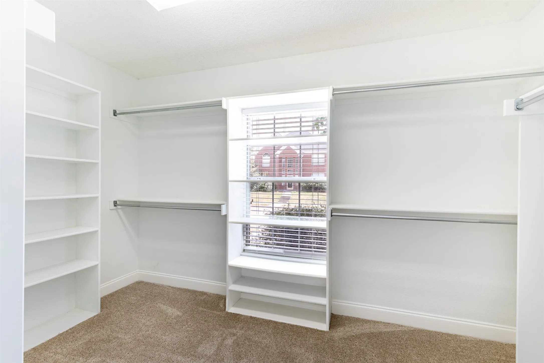 Primary suite's closet with built-ins.