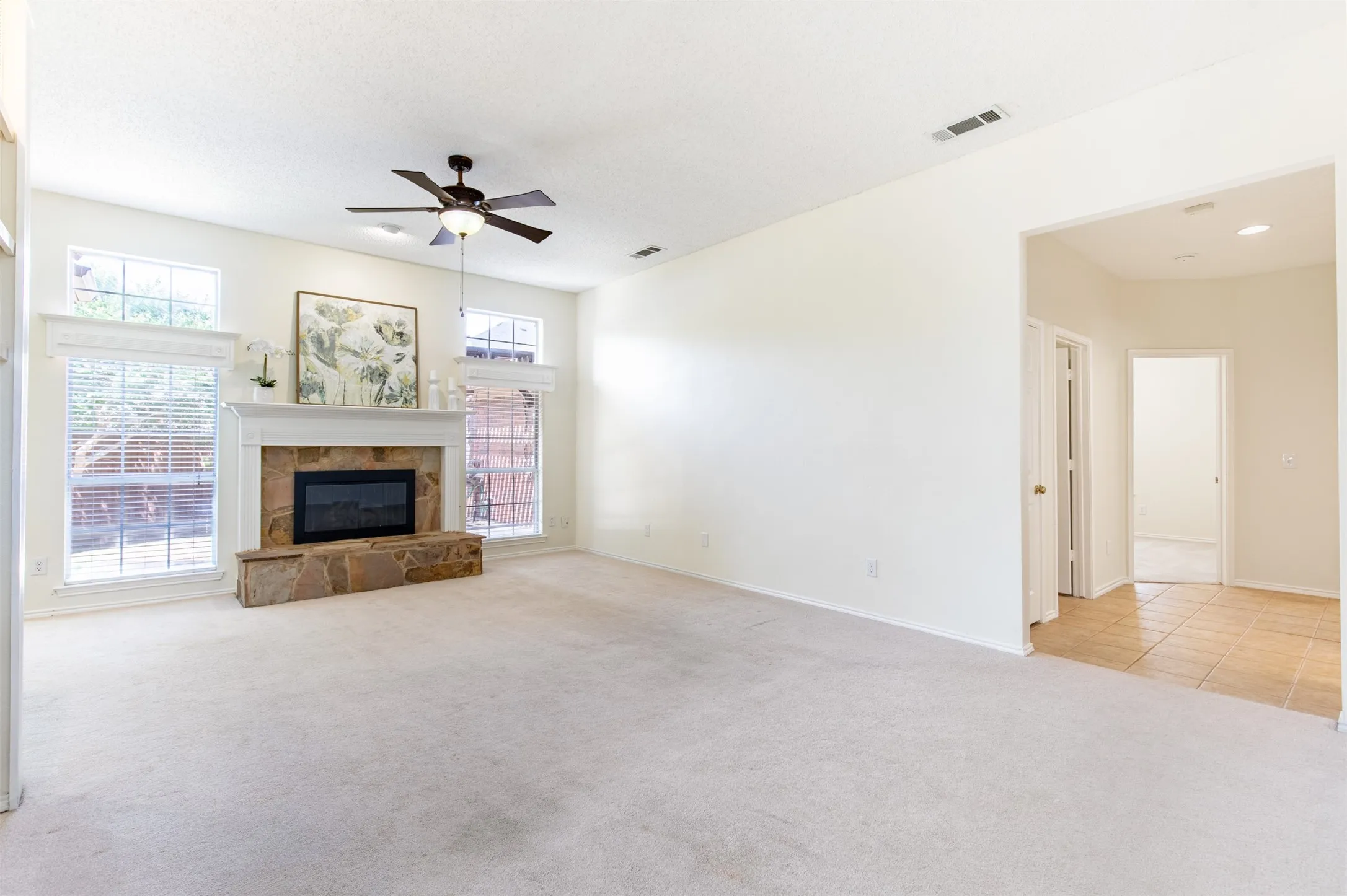 Living room with entrance to bedroom wing.