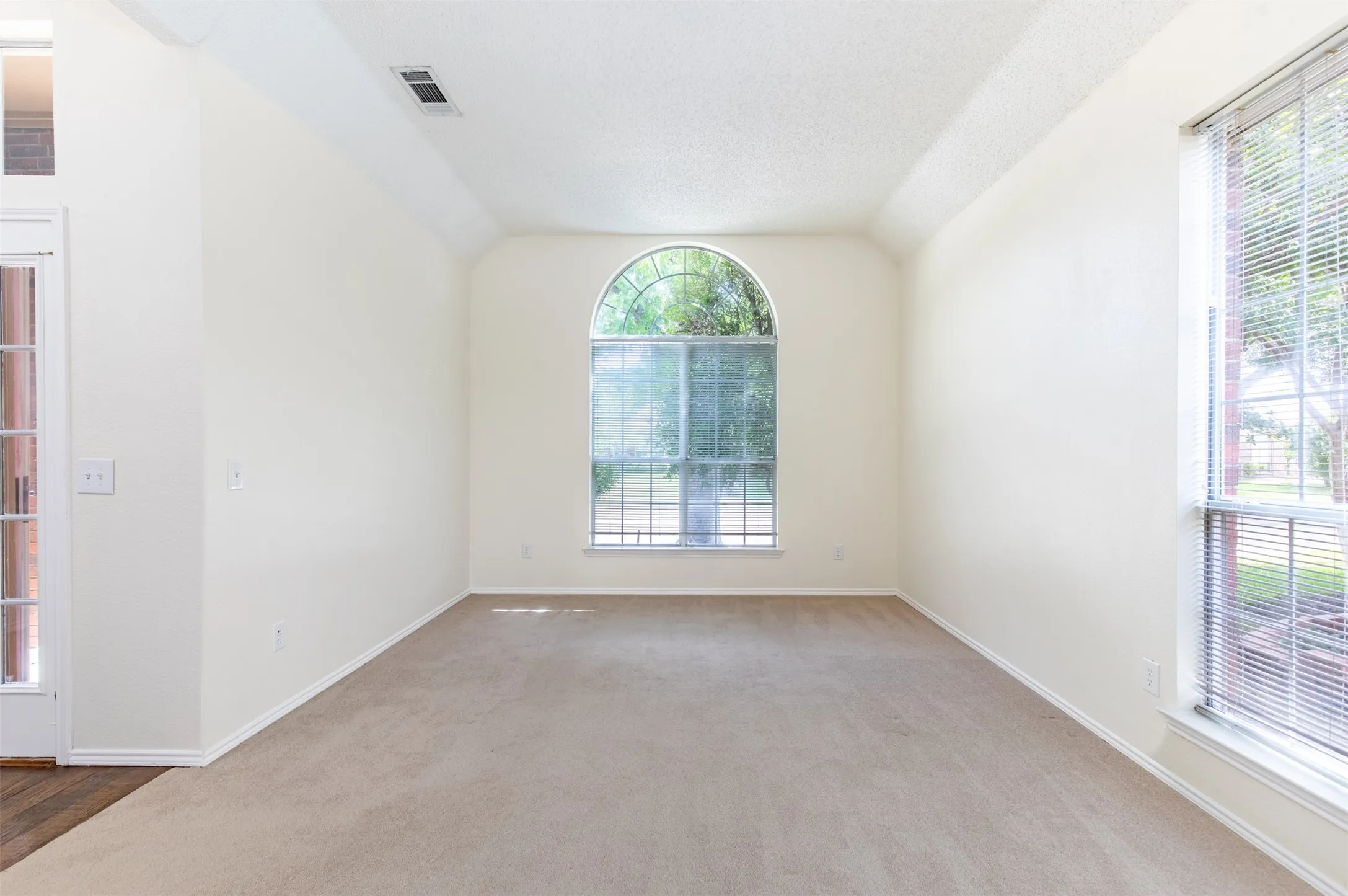 Formal living room overlooking the front of the home.