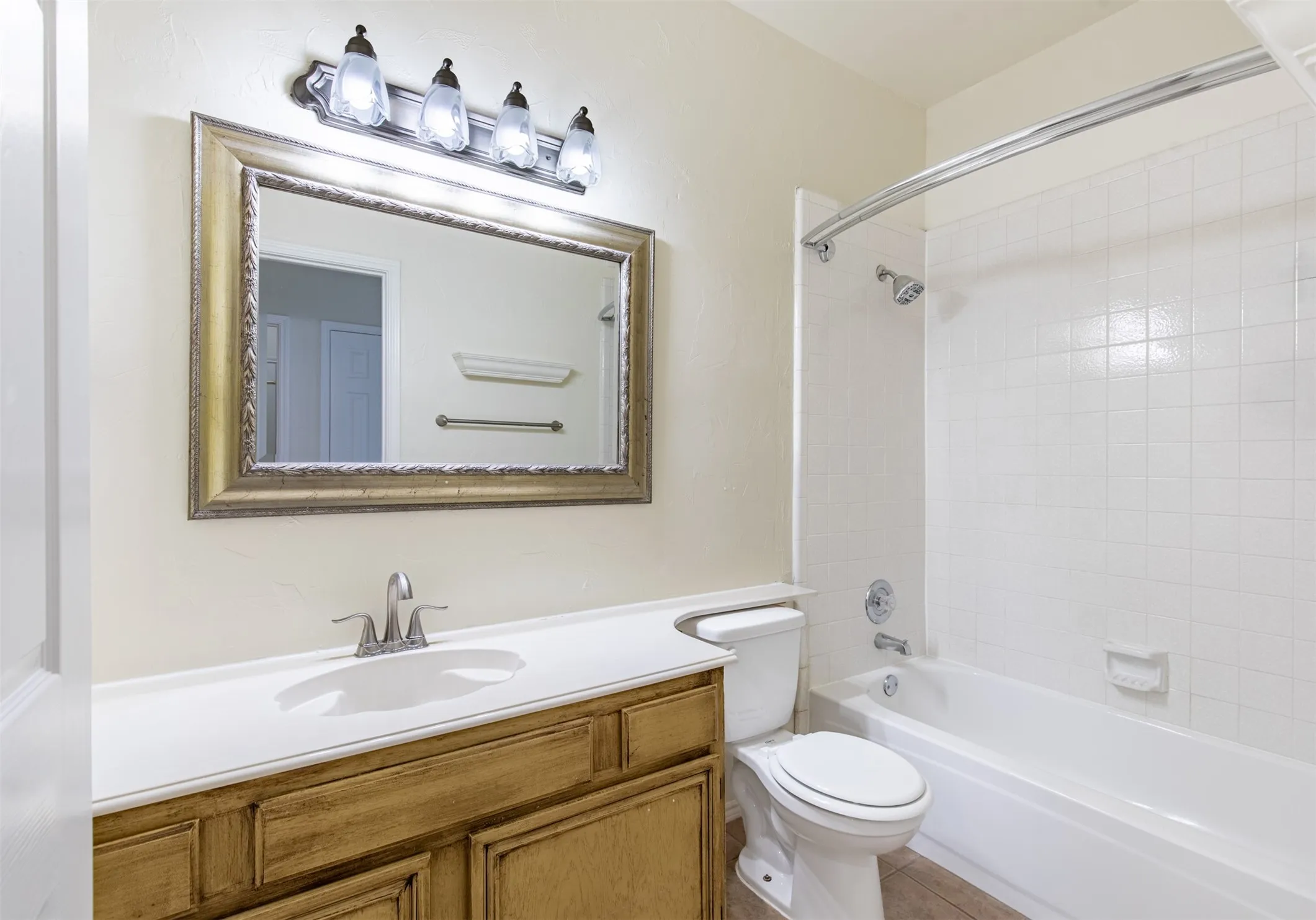 Secondary full bath with tub/shower combo.