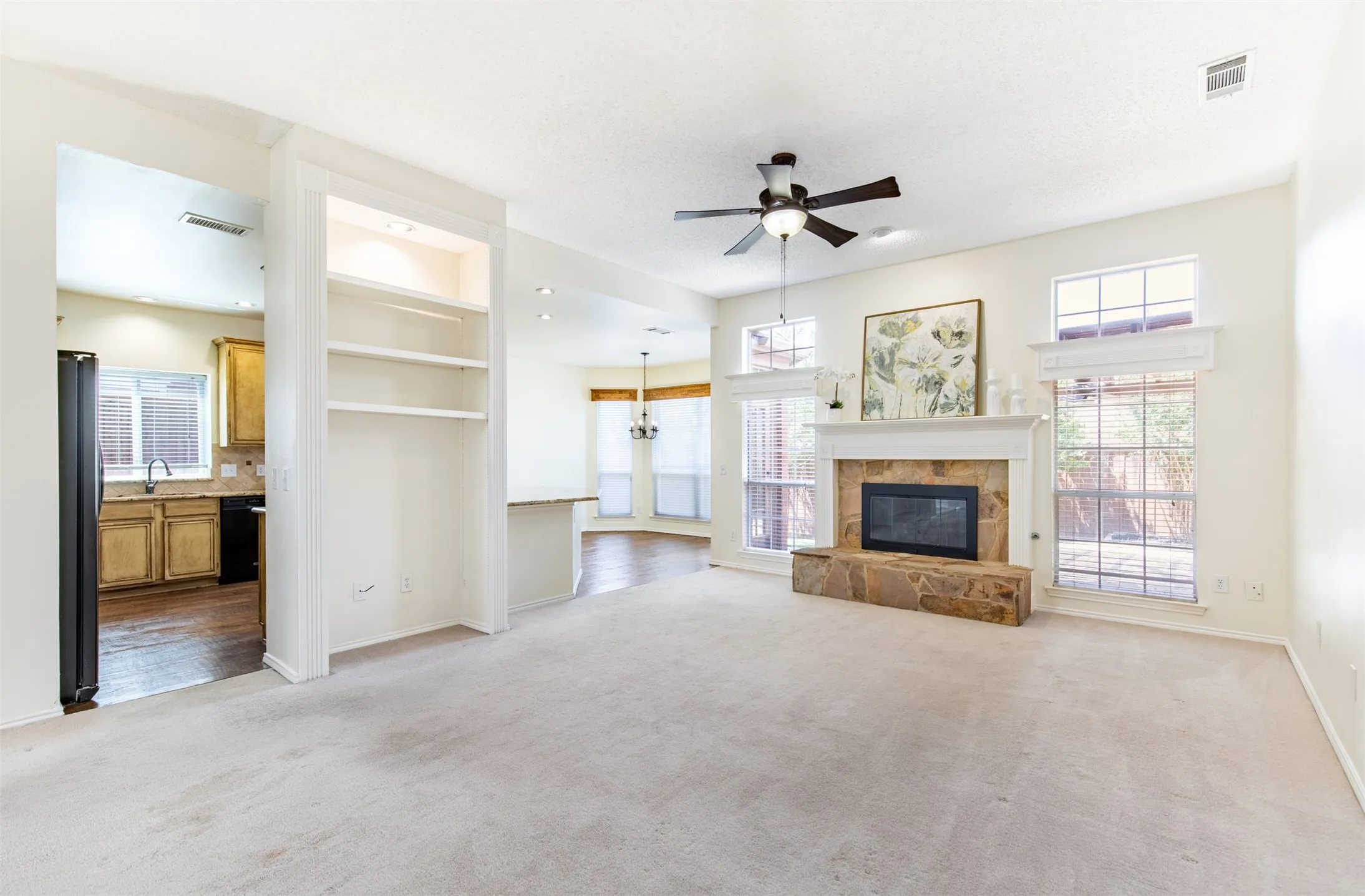 Living room showcasing entry to kitchen and breakfast room.