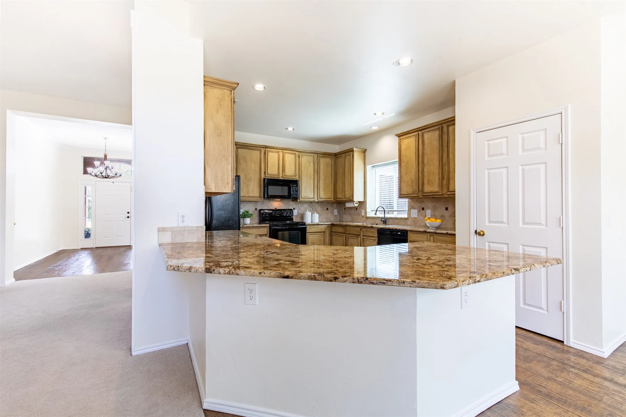 Kitchen with eat-in breakfast bar.