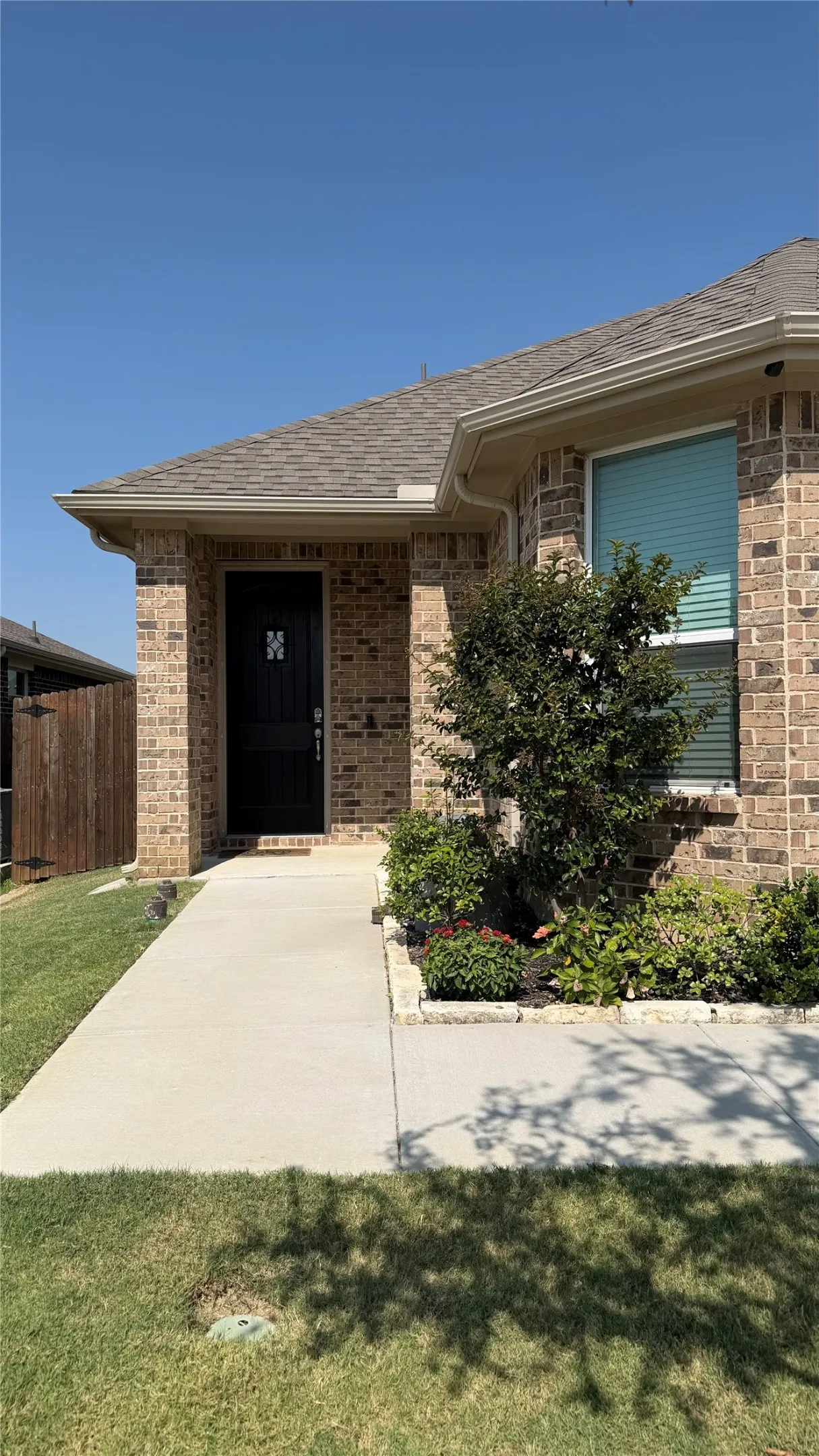 Brick exterior construction with an asphalt shingle roof