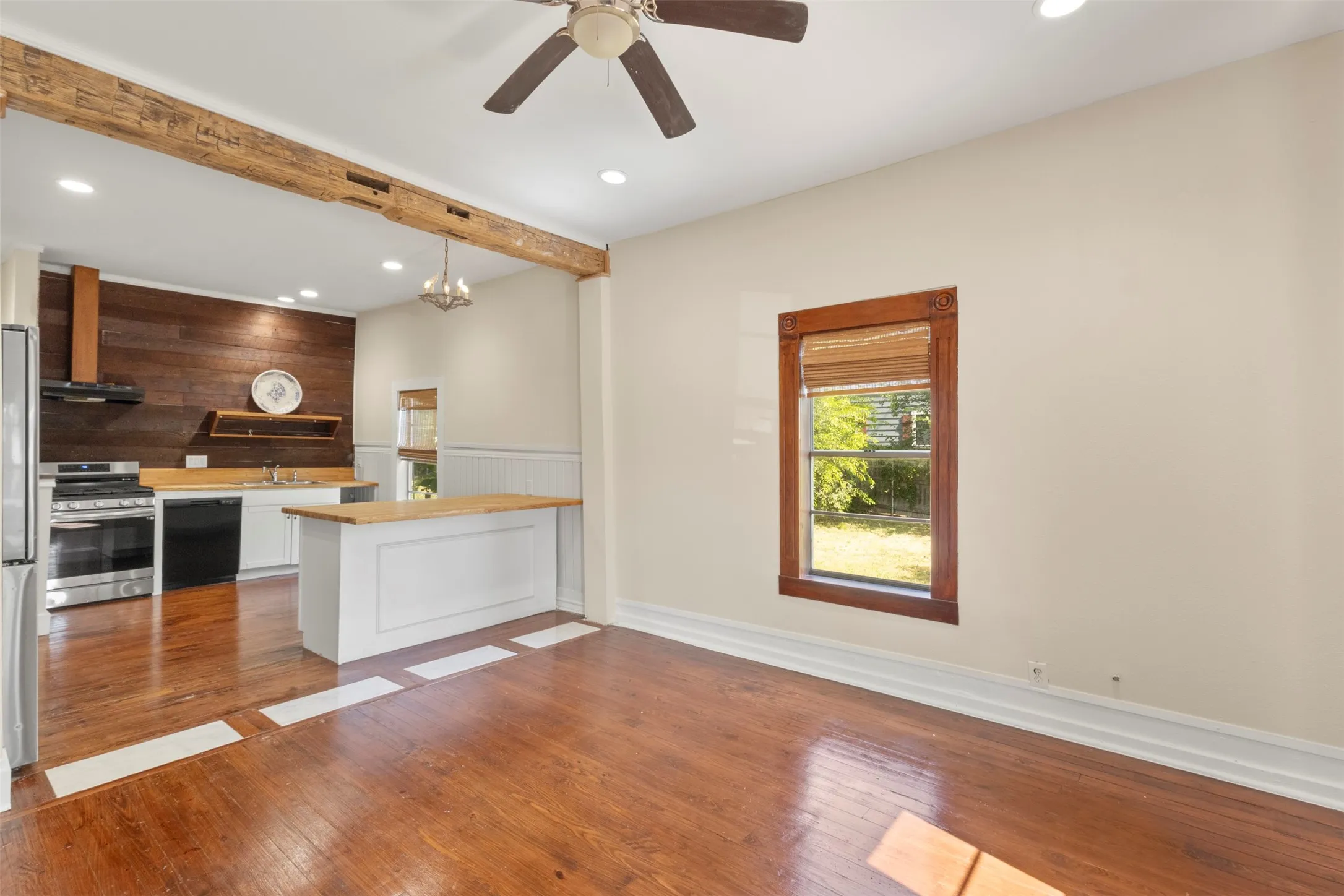 Wood-finish flooring throughout the main area and kitchen