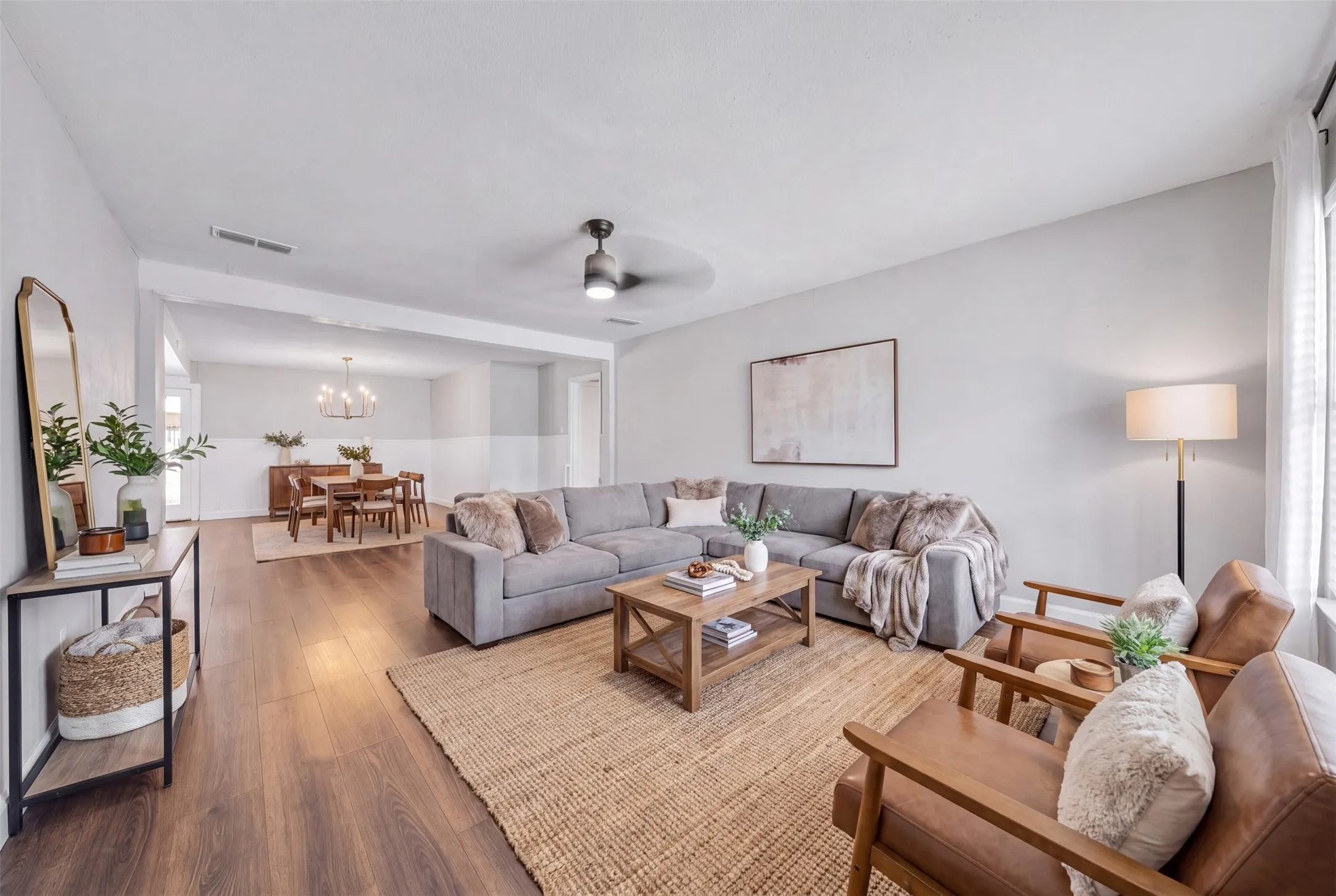 Large open living and dining. Virtually staged.