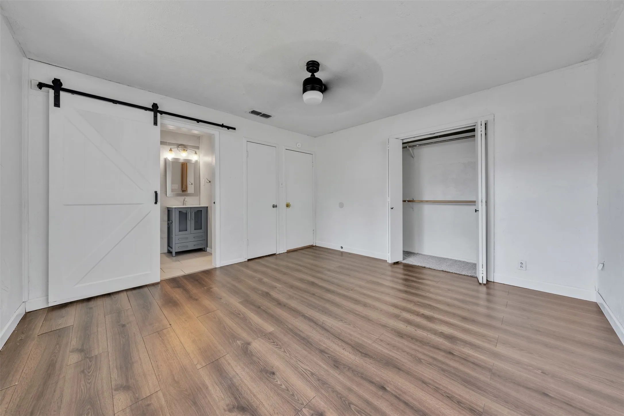 Barn door leads to ensuite bathroom!