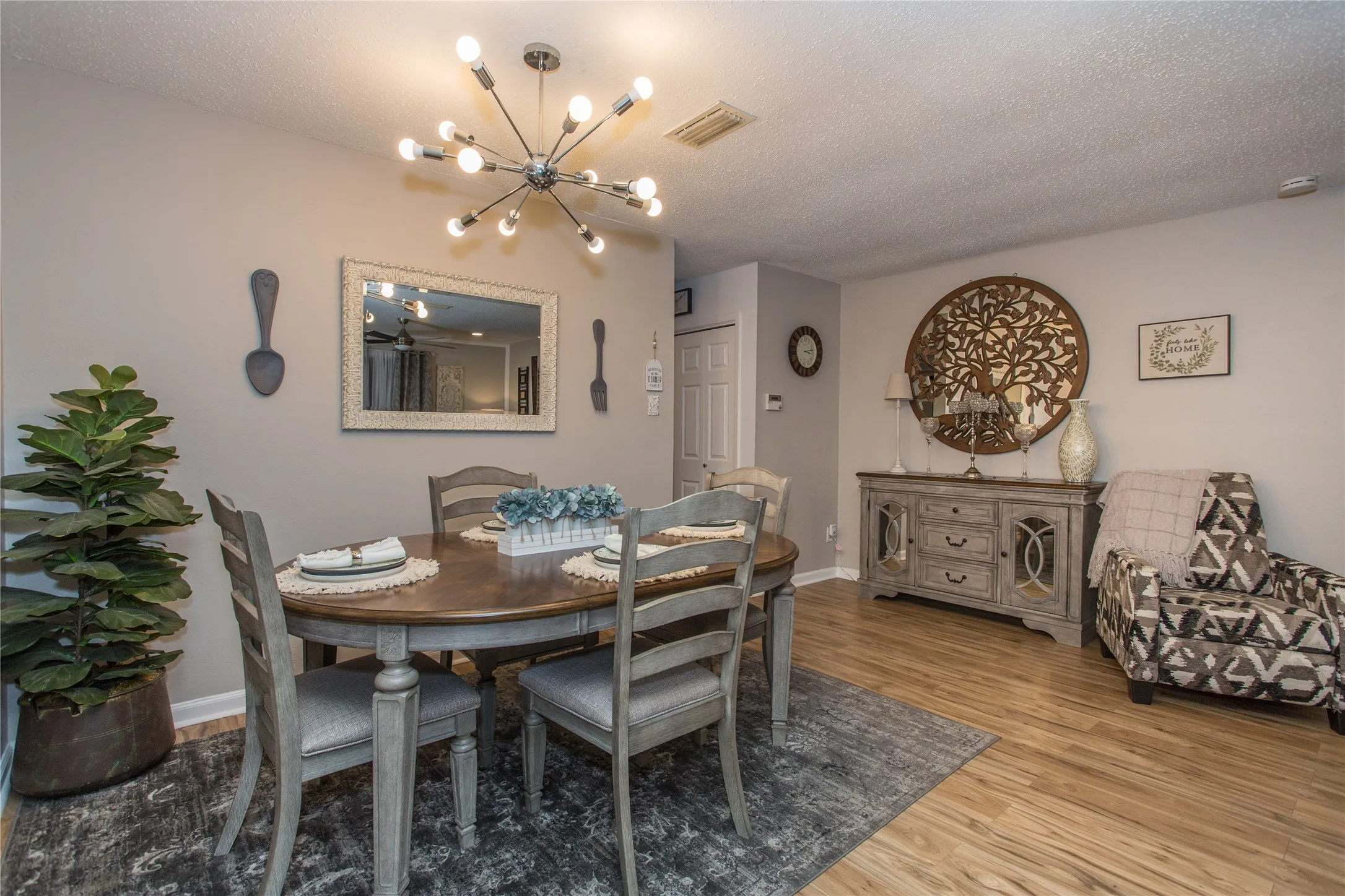 Dining area featuring wood-finish flooring and neutral wall tones