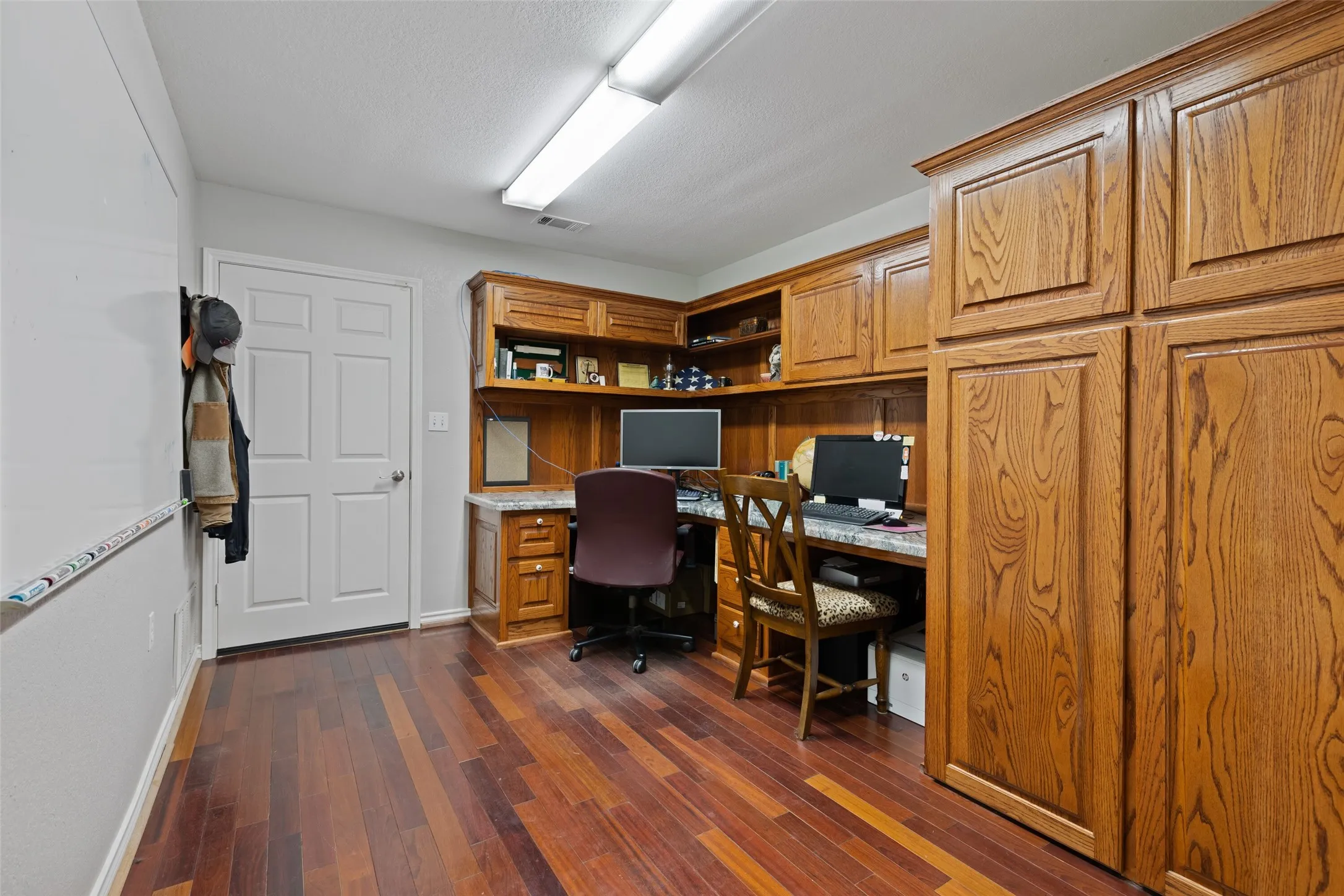 Office near the garage and separate laundry room.