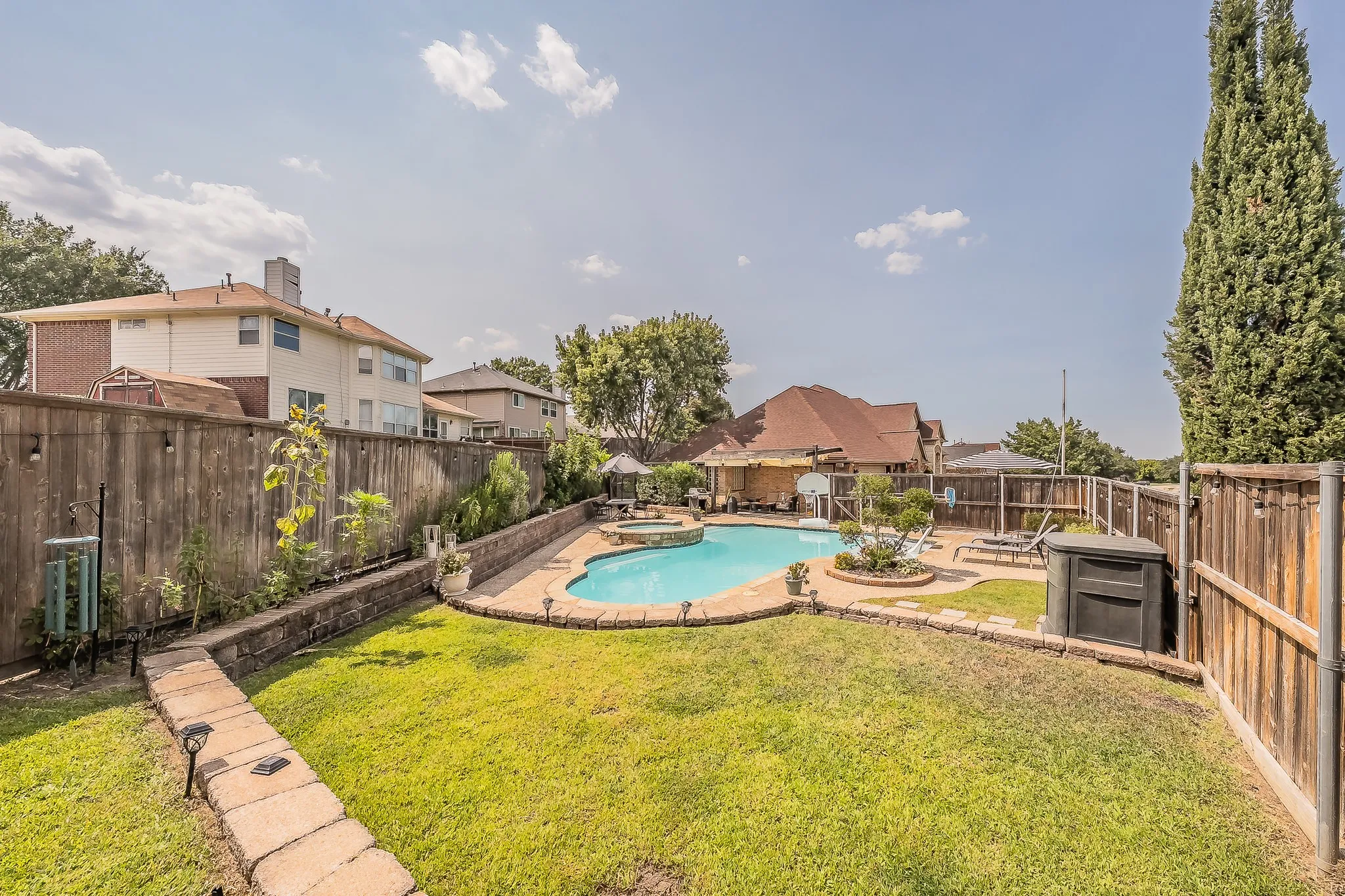 .420 of acre with two yards one with pool the other is a large grass area. Lots of room to roam and romp!