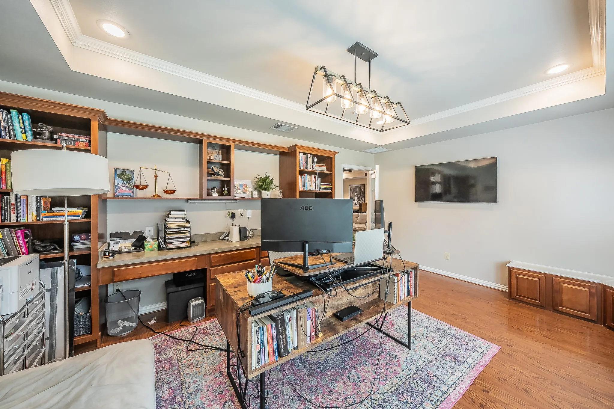 Tray ceiling with recessed lighting and crown molding