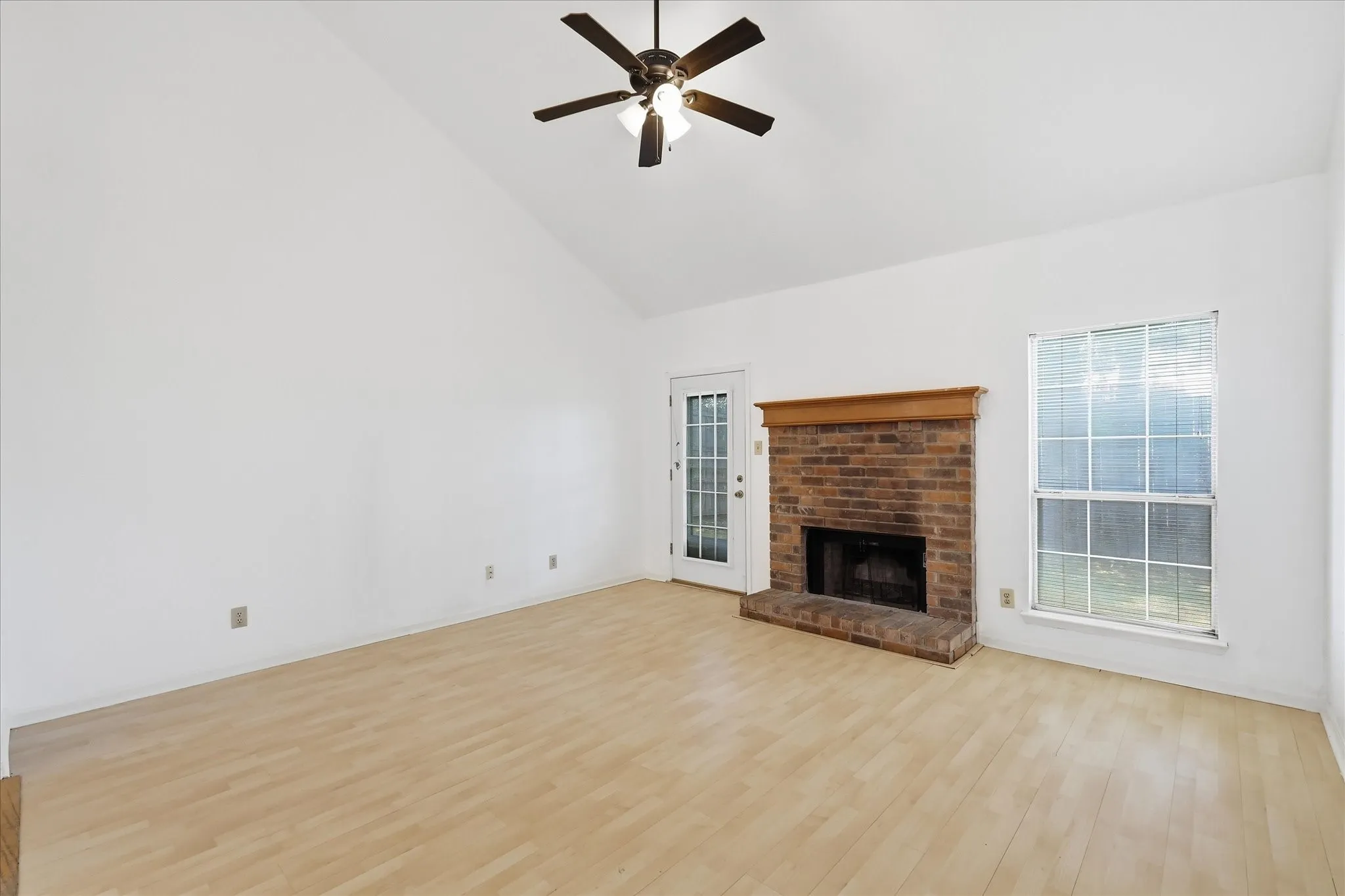 Open Living area with wood burning fireplace.