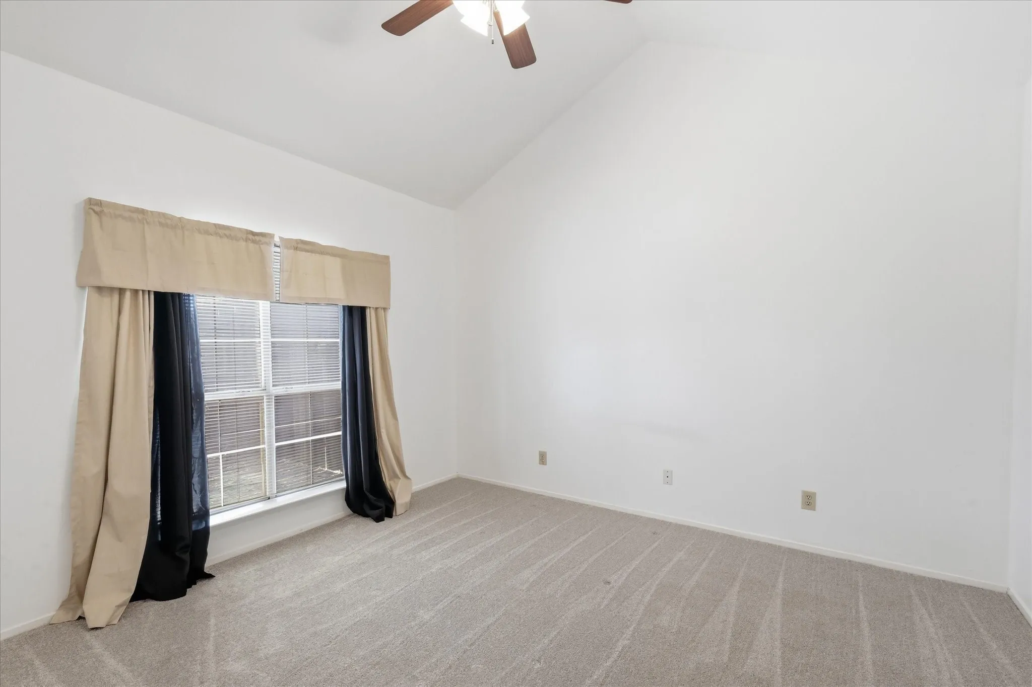 New carpet, paint and ceiling fan.