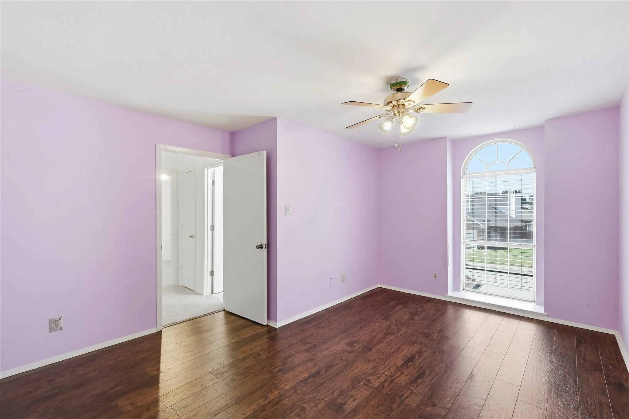 Secondary bedroom upstairs with wood floor and large closet