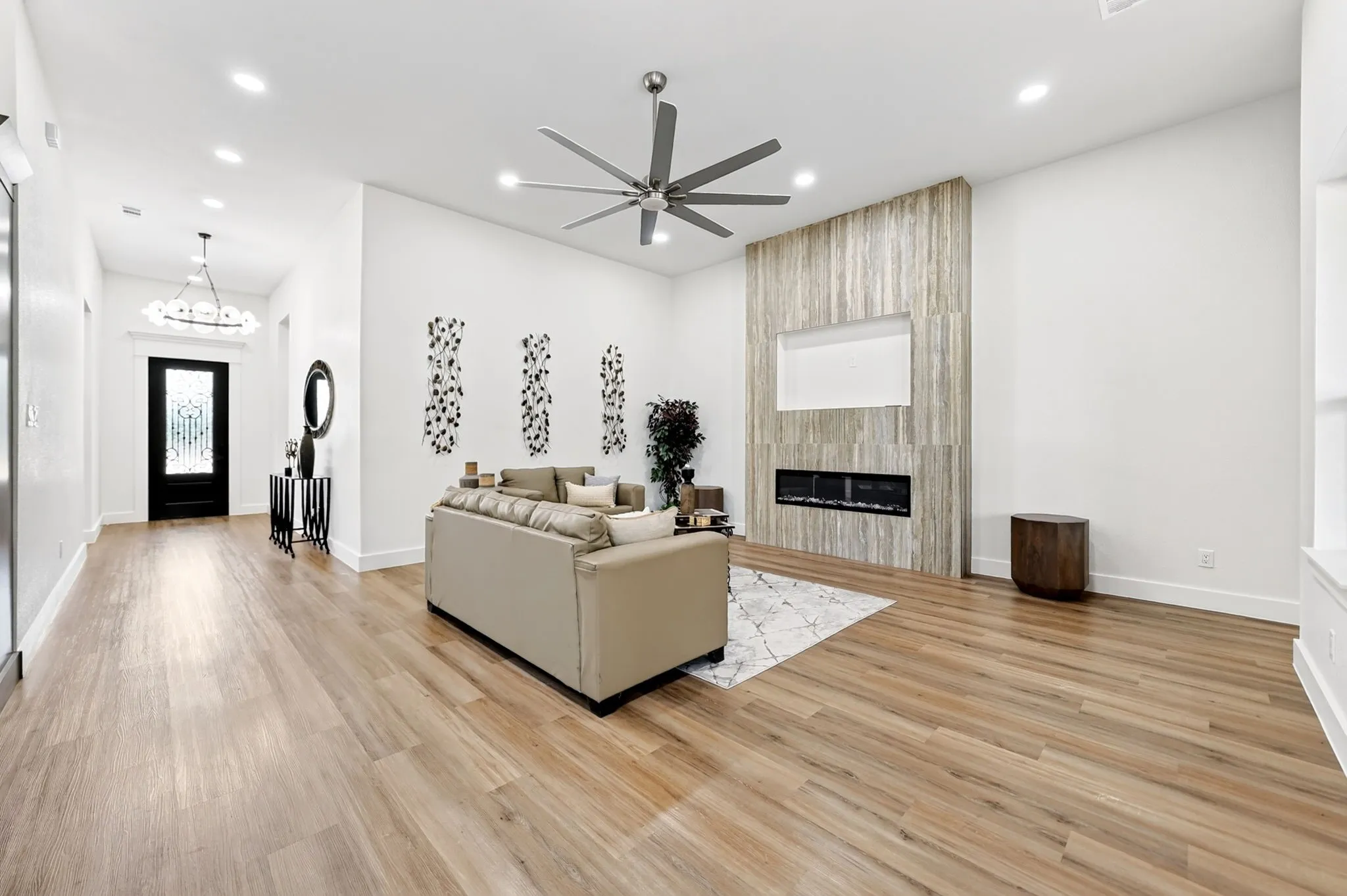 Open-concept living area featuring wood-finish flooring, recessed lighting, and a modern ceiling​​‌​​​​‌​​‌‌​‌‌​​​‌‌​‌​‌​‌​​​‌​​ fan