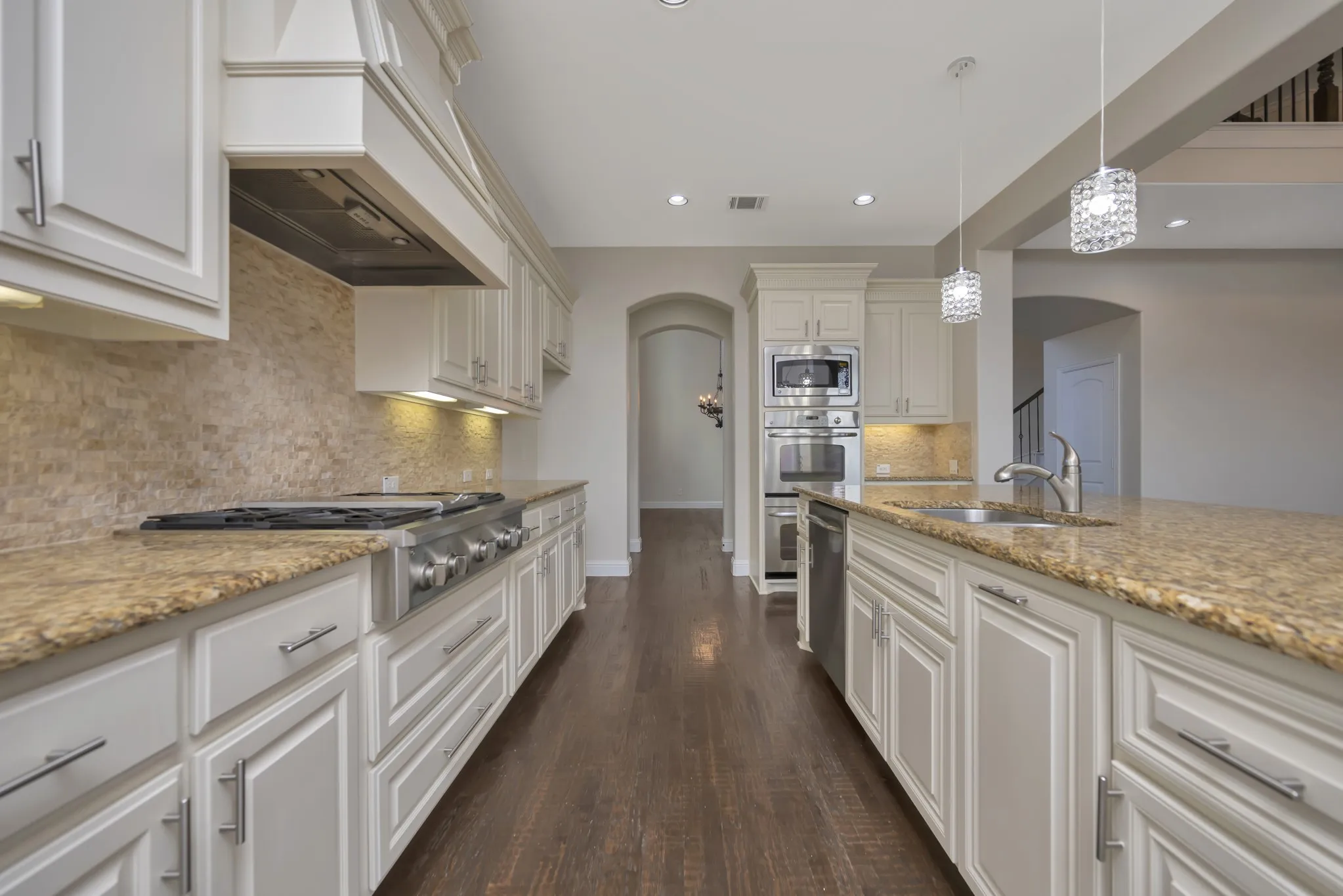 Upgraded Kitchen with Granite, SS appliances, Gas Cooktop, leads to the Dining Room and Breakfast area too!