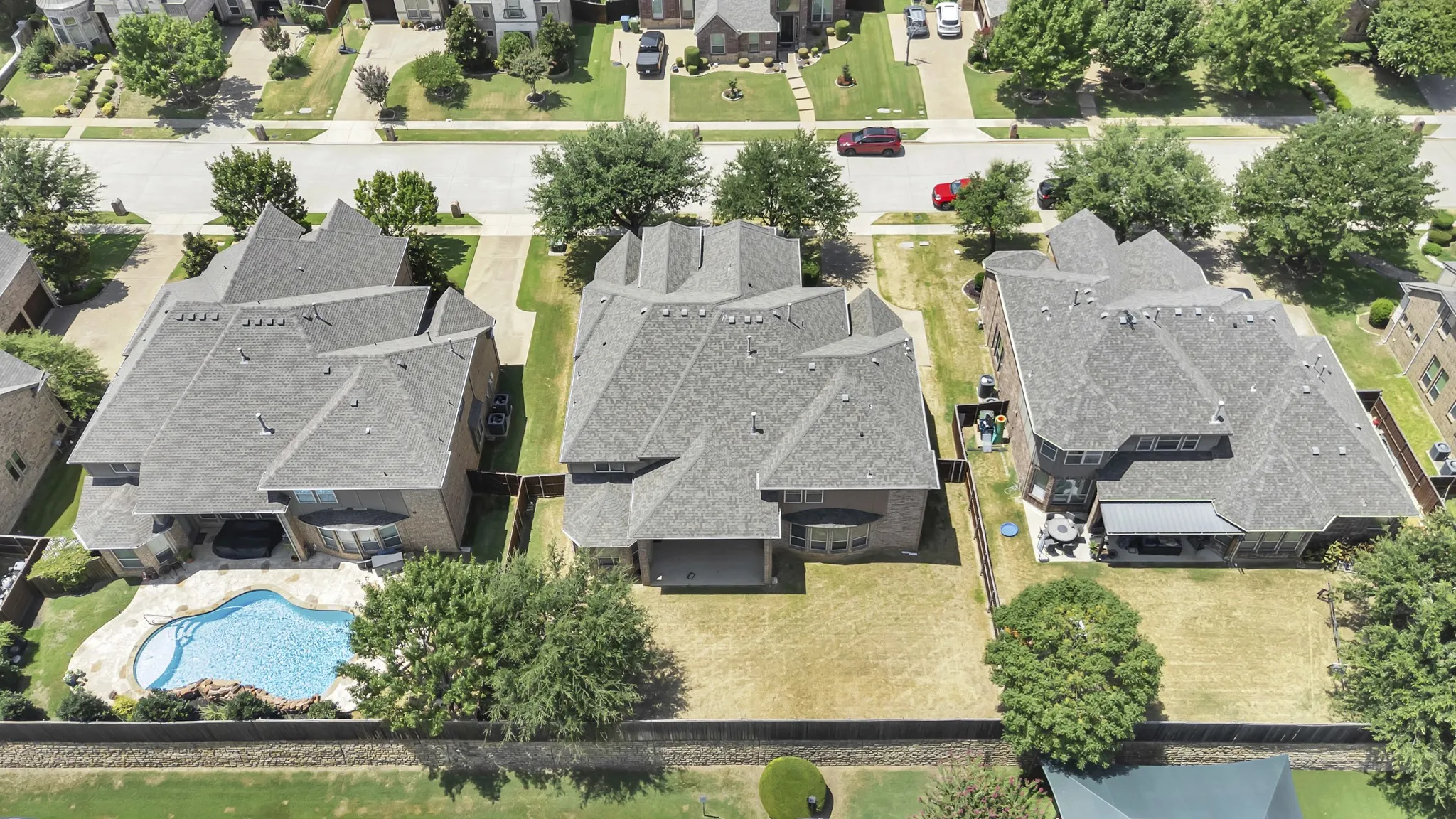 Drone shot of the pool-sized backyard!