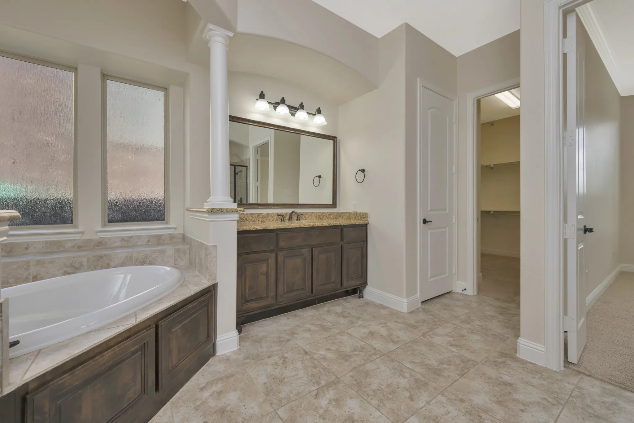 Another view into 1 of 2 primary bedroom closets!