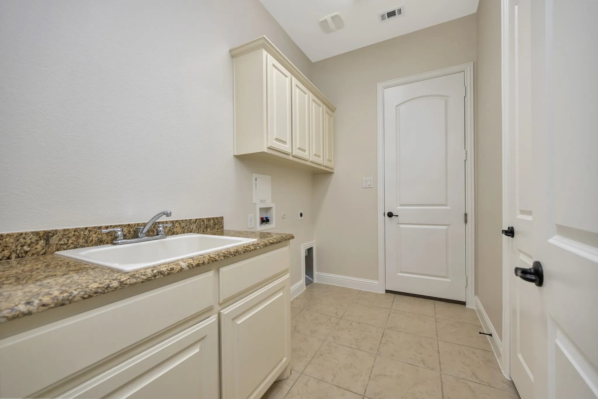 Laundry room is off the 1 car garage and Primary closet, for easy access.