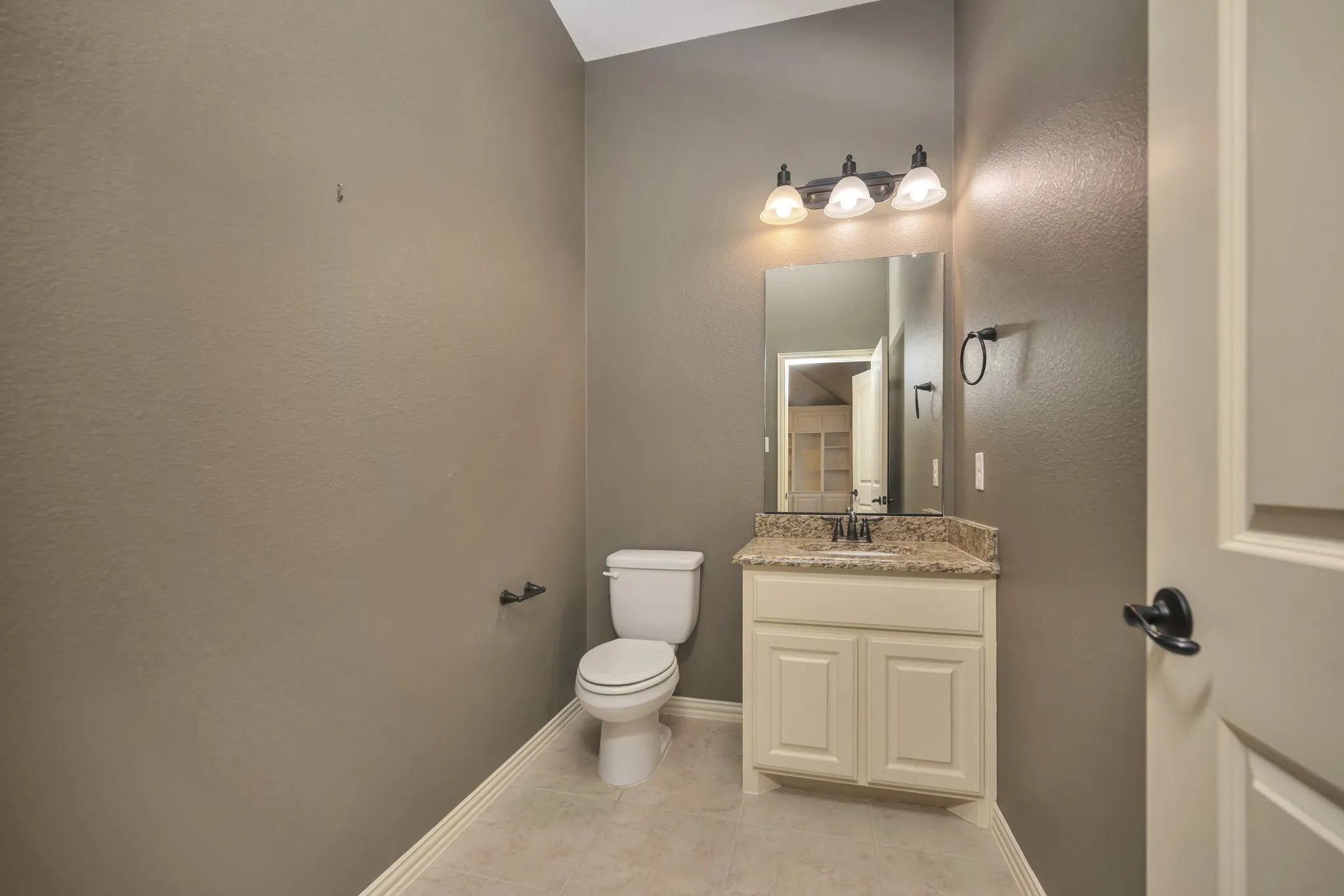 Half Bath located off Game and Media rooms.