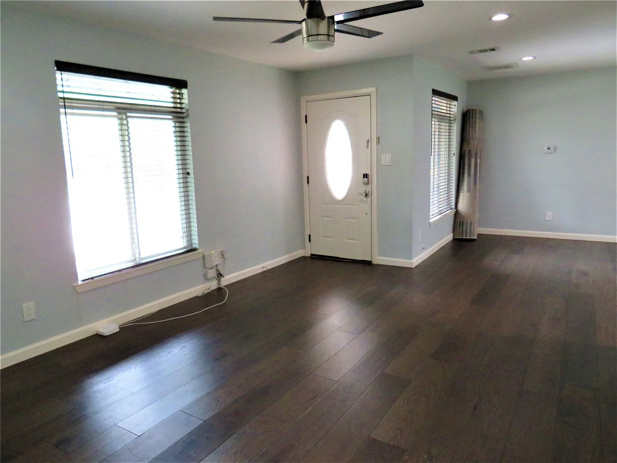 Wood-finish flooring, recessed lighting.