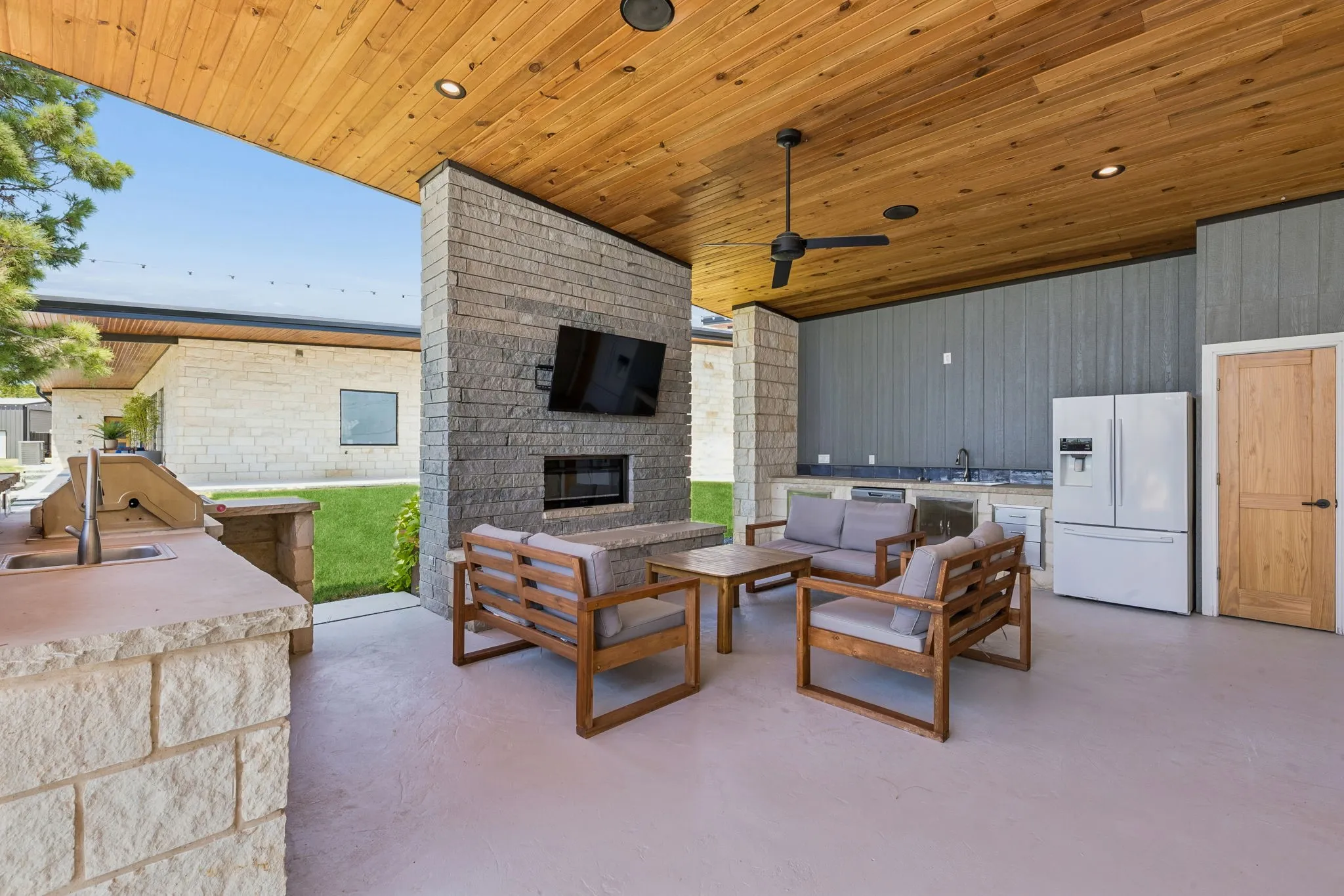 Outdoor kitchen and patio area of pool house