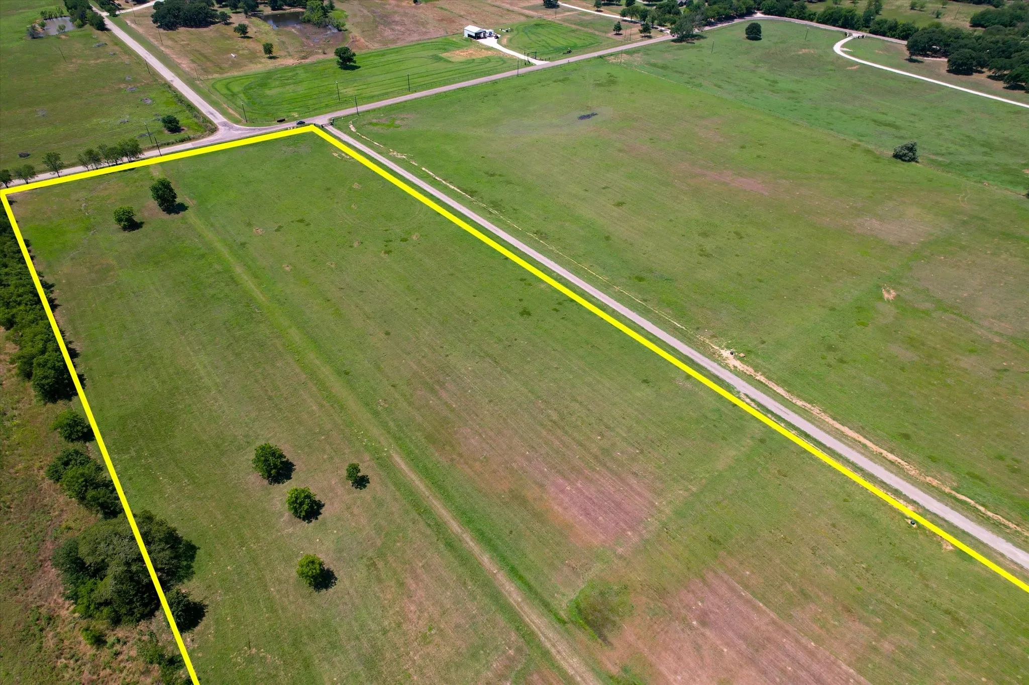 Expansive green acreage featuring a clear boundary line