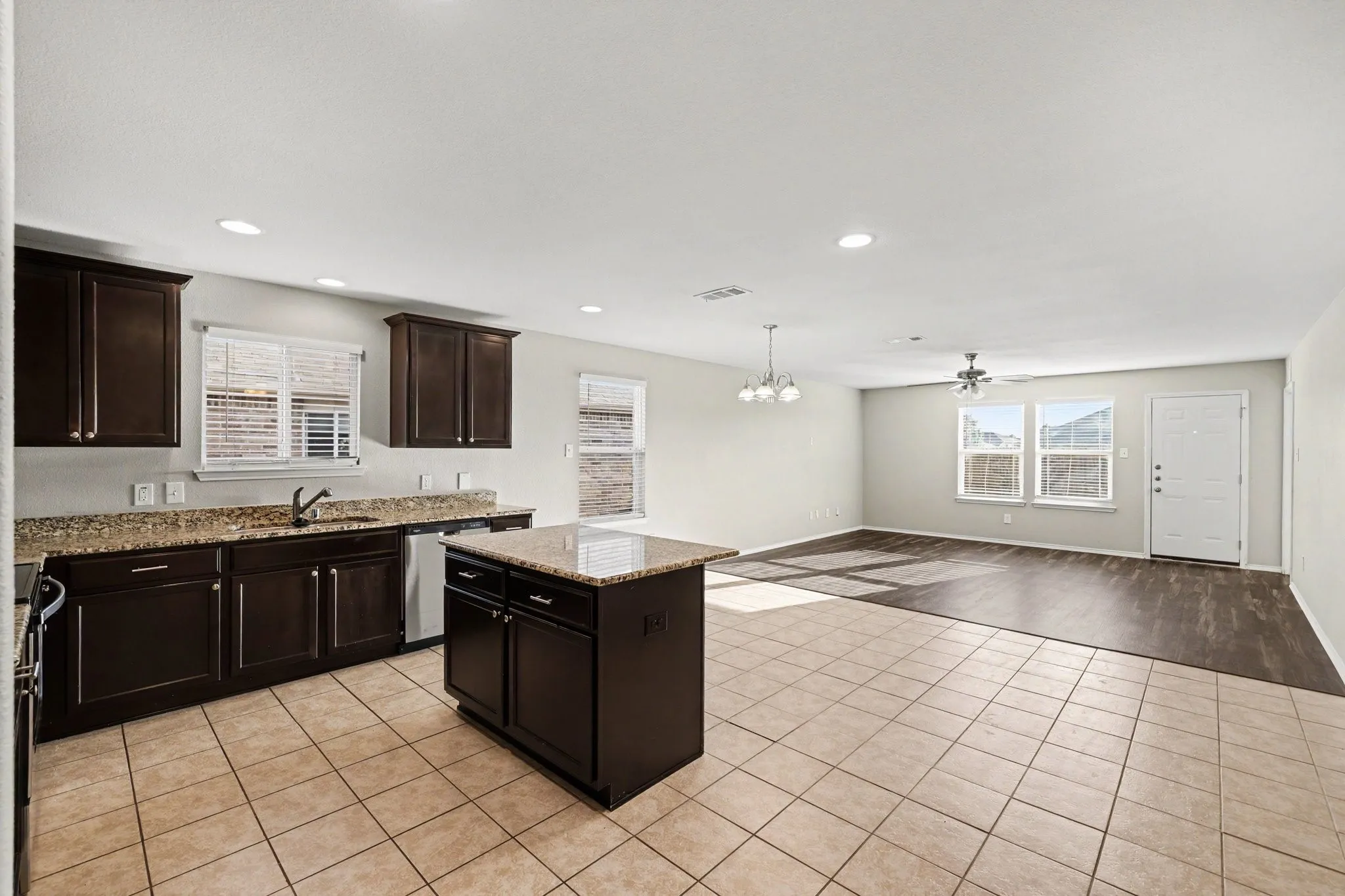 View of kitchen into the dining and family room. Open floorplan