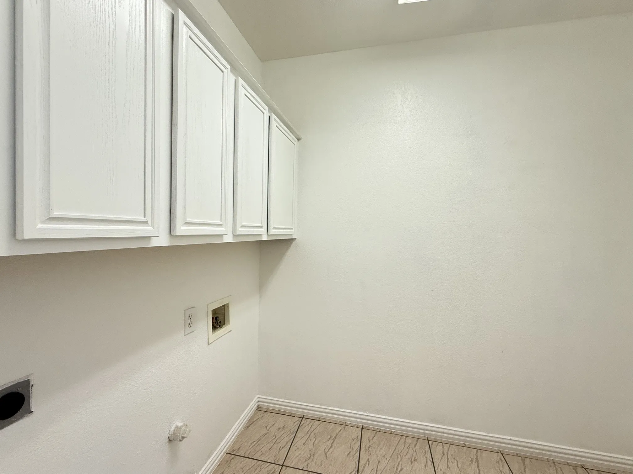 Laundry is downstairs with additional cabinets