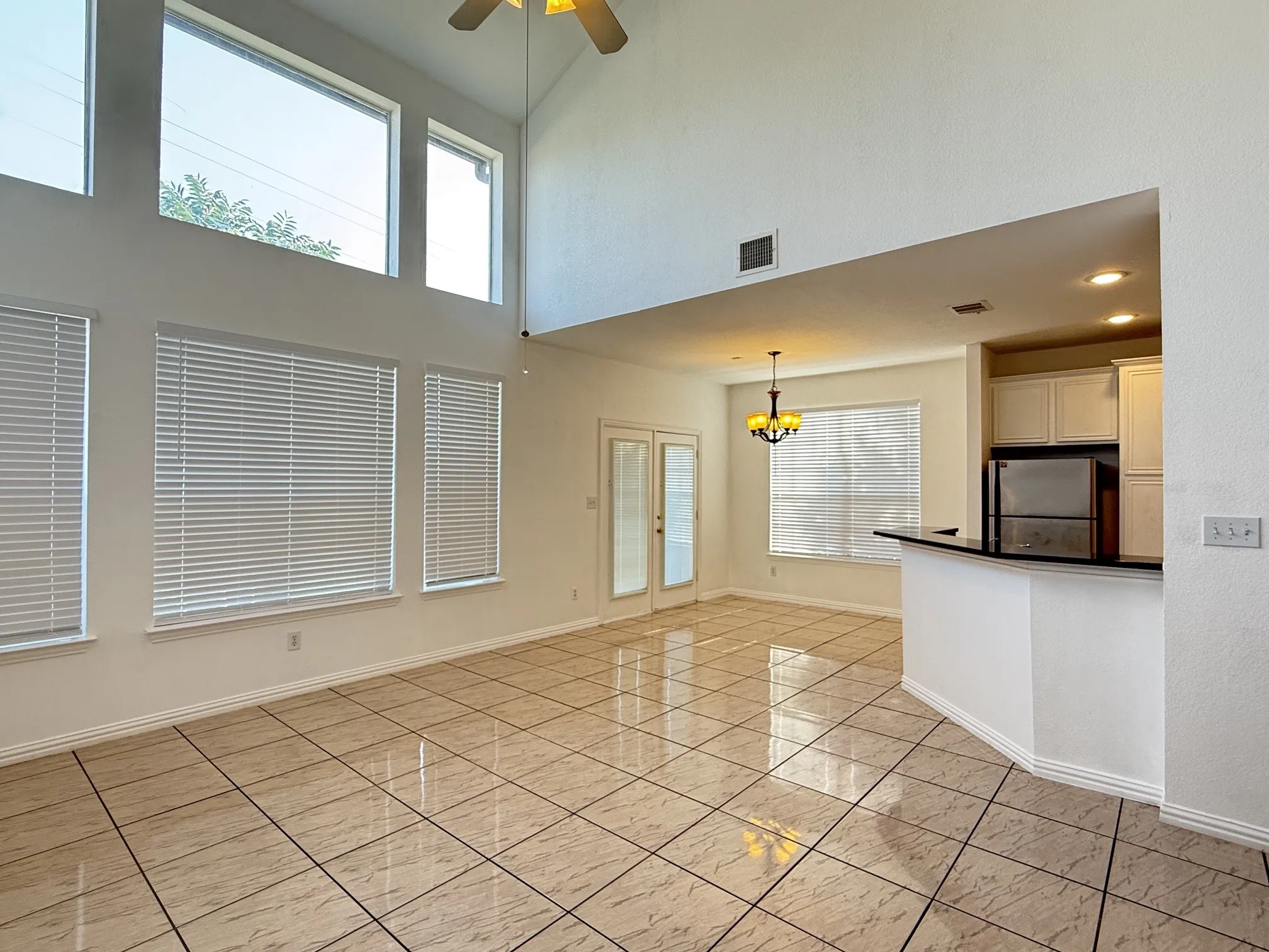 Spacious living with high ceiling and lots of windows for natural light