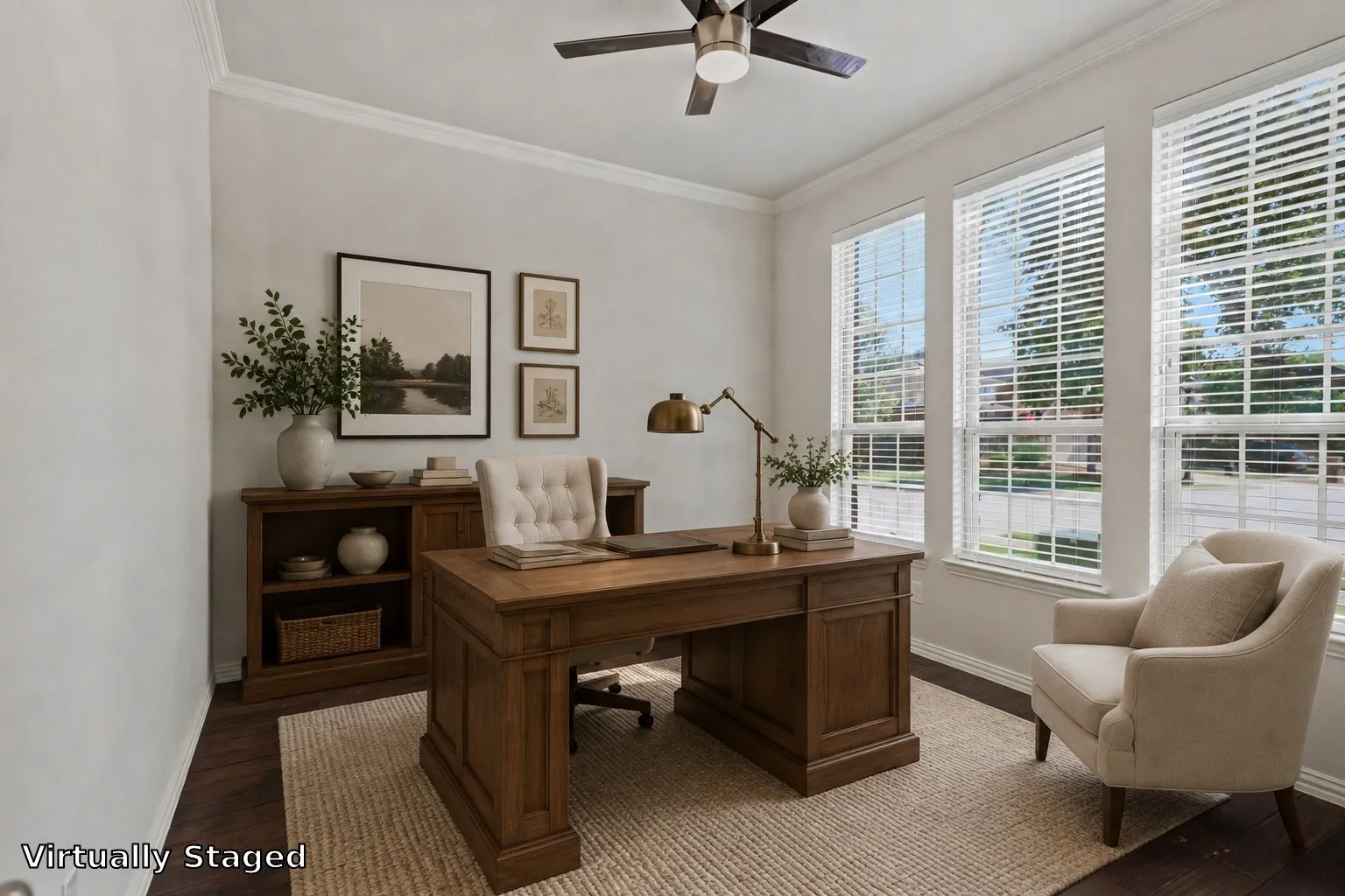 Crown molding, dark wood-finish flooring, three large windows, and a ceiling fan with integrated lighting