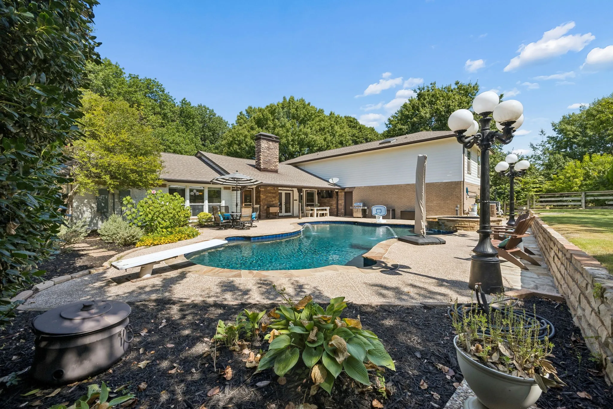 Diving pool surrounded by landscaping
