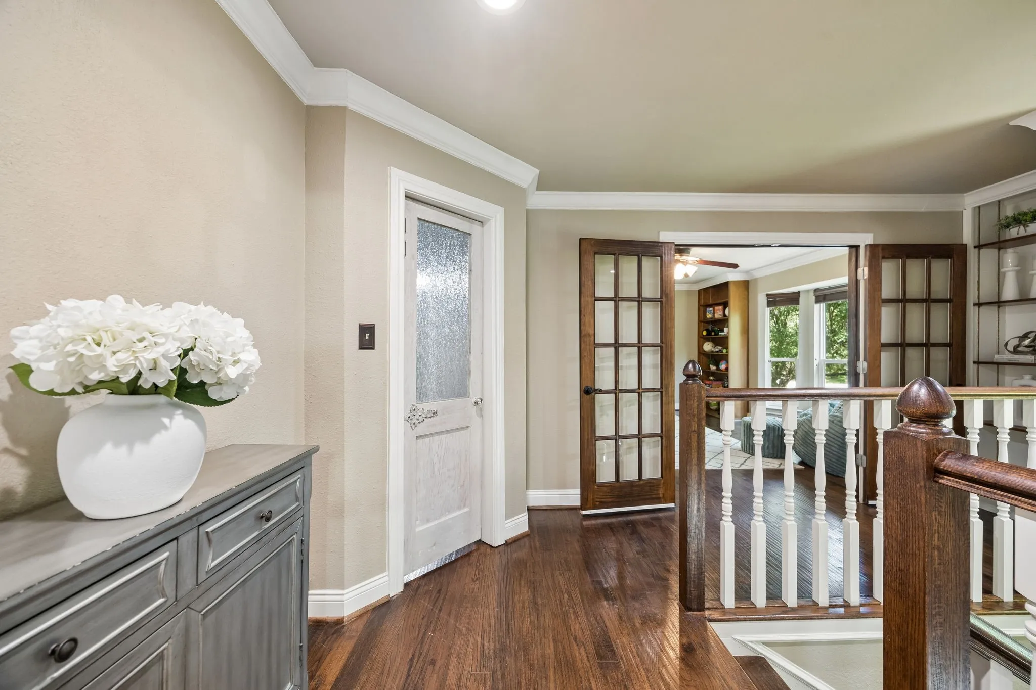 Upstairs antique door to craft space and french doors to the game room