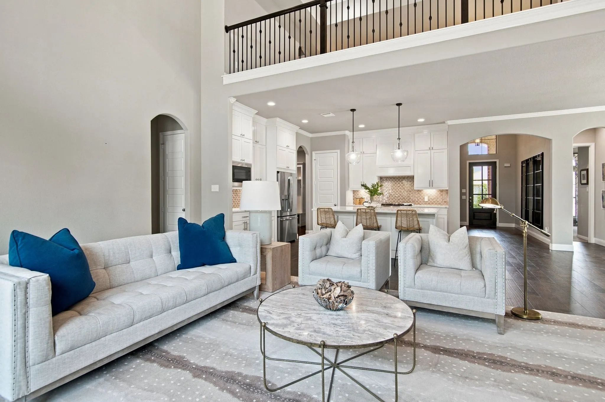 Two-story living area with an open-concept kitchen