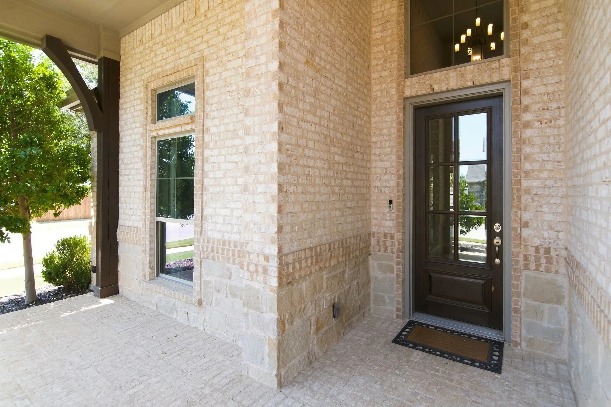 Brick exterior with stone accents and a covered front porch