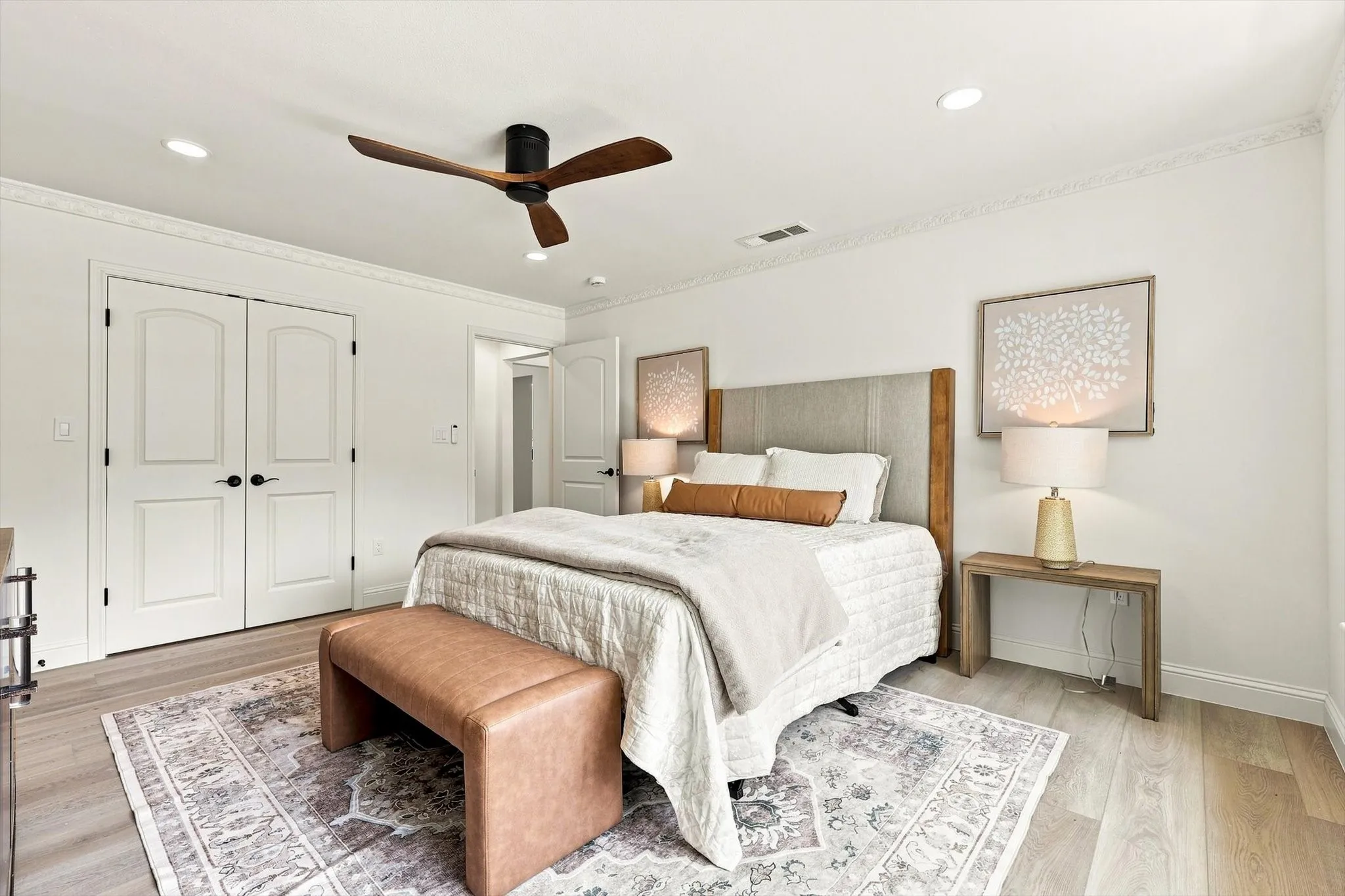 Another view of primary bedroom with 1 of 2 closets showing.