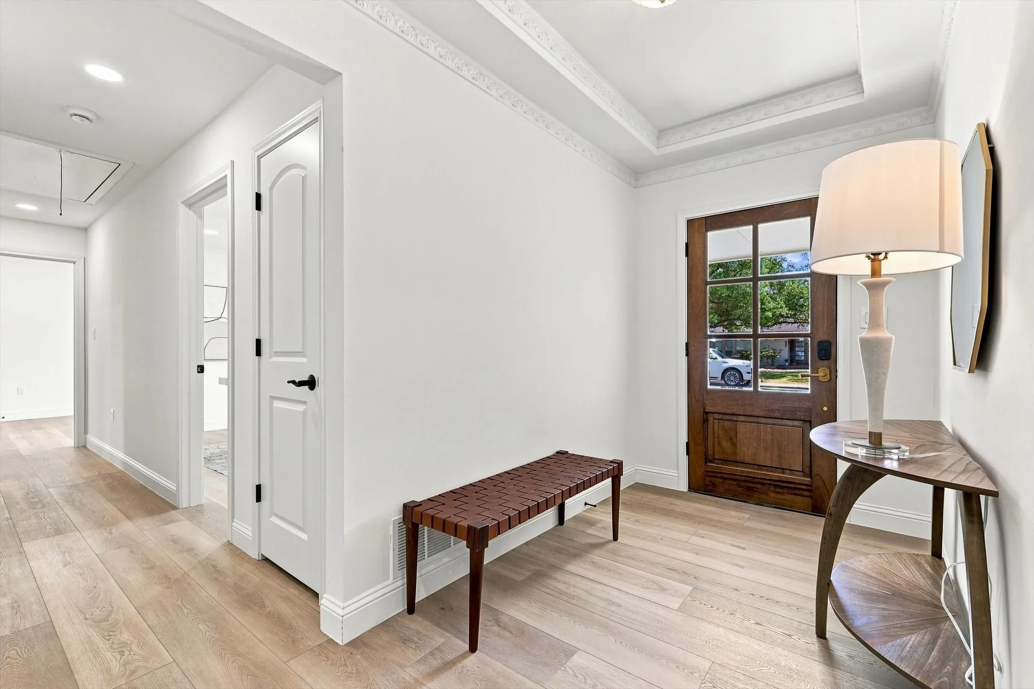 Entry features new solid wood oak front door. Home features luxury vinyl plank flooring throughout home
