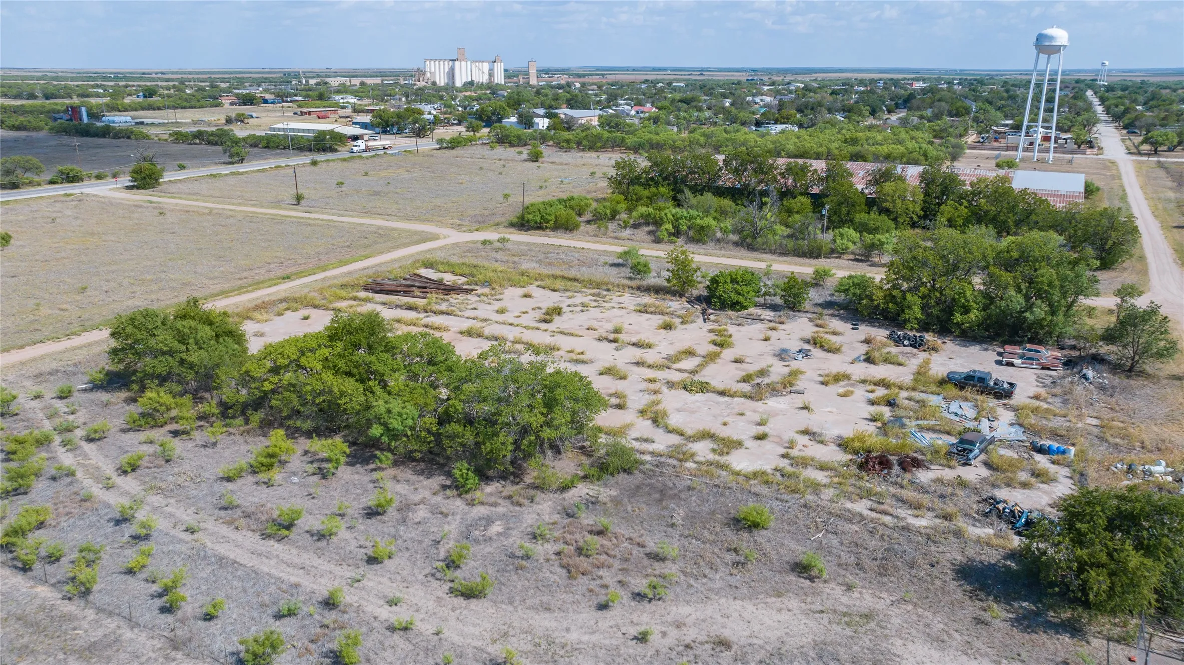 Expansive land parcel featuring open terrain and scattered trees