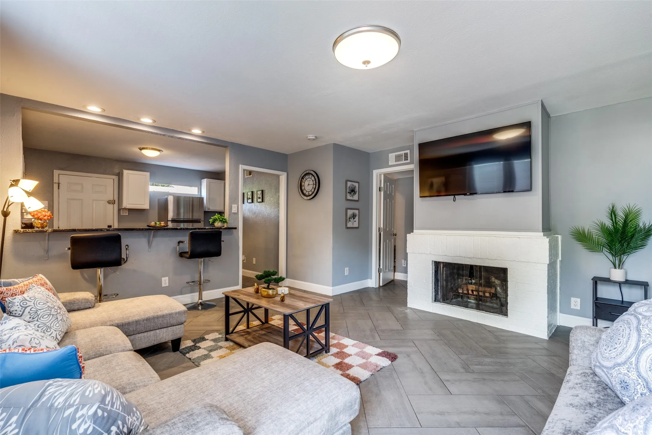 Inviting living room with fireplace and open to the kitchen