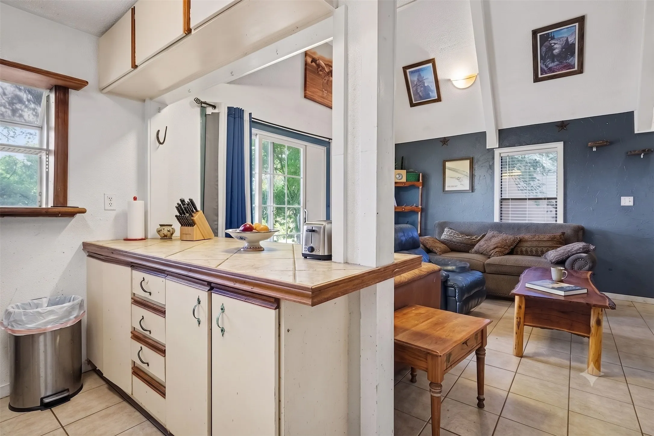 Kitchen breakfast bar overlooking the main living room, ideal for casually dining or entertaining.