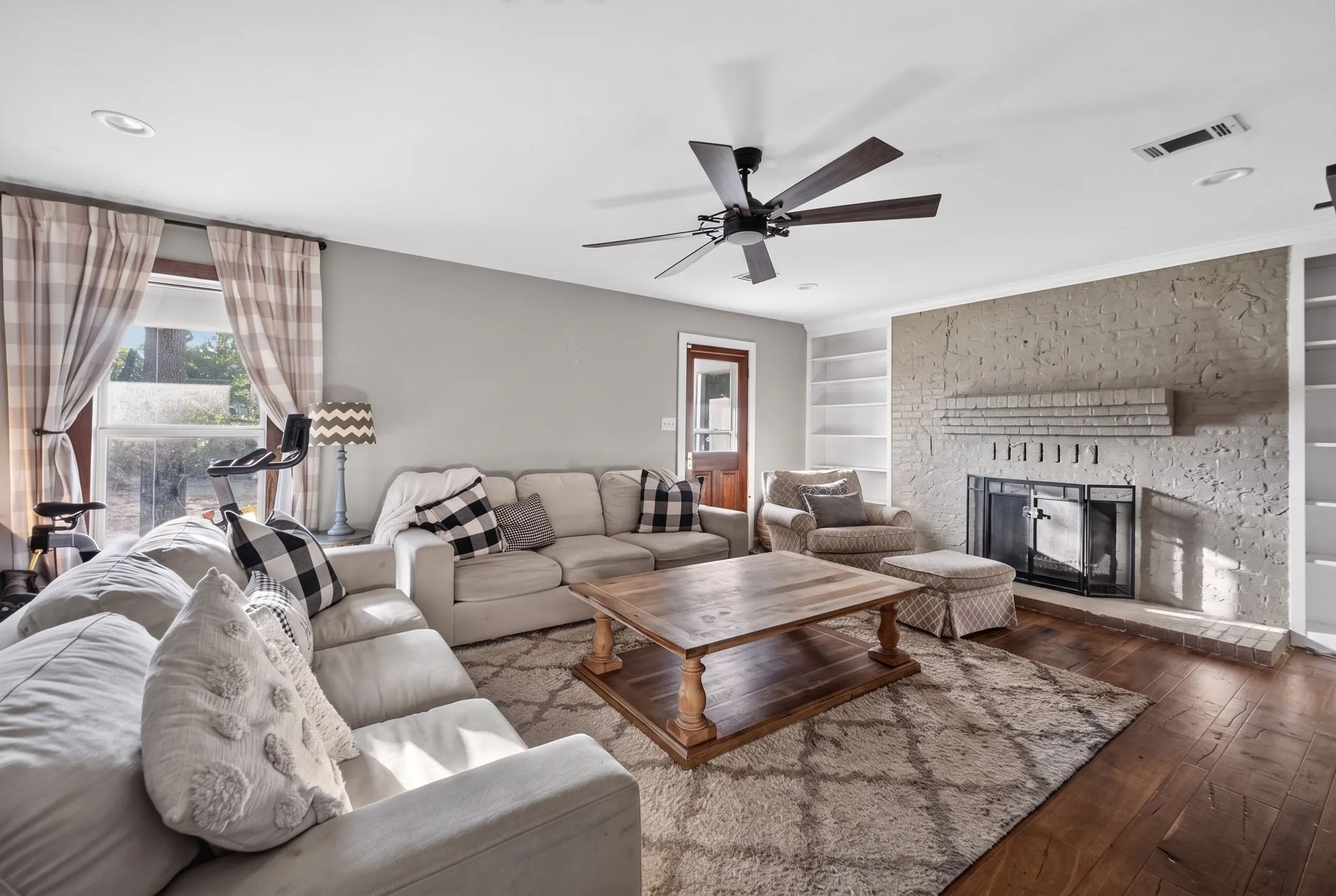 Wood-finish flooring, recessed lighting, and a ceiling fan