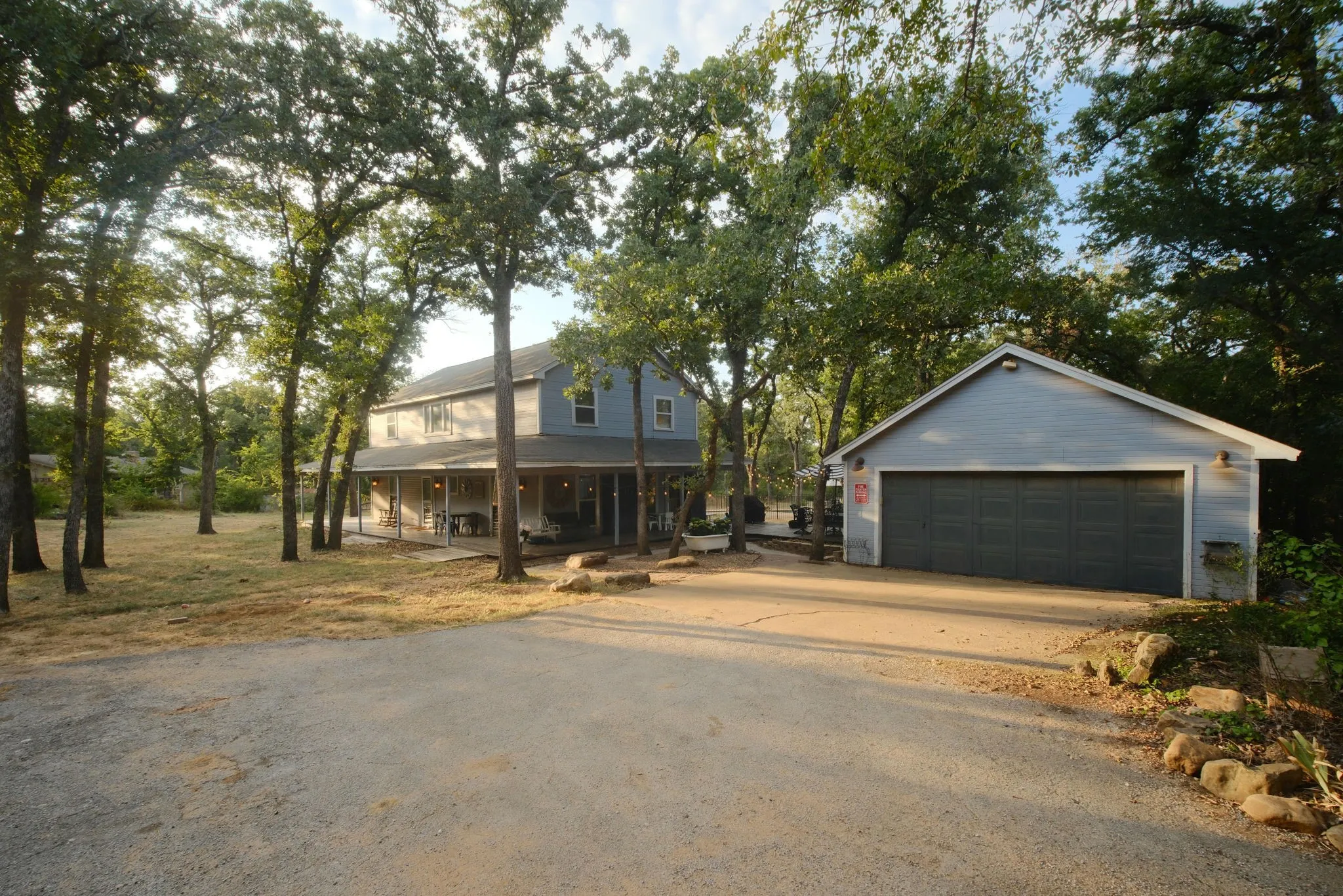 Charming two-story residence nestled among mature shade trees on a spacious lot