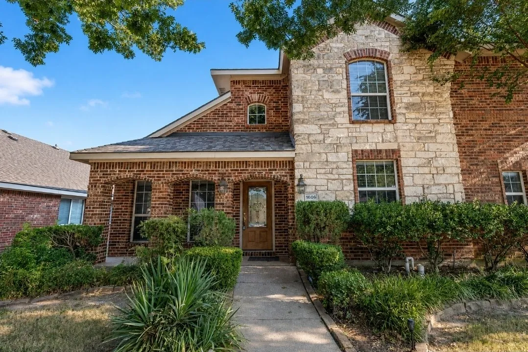 Brick and stone exterior with arched window detailing